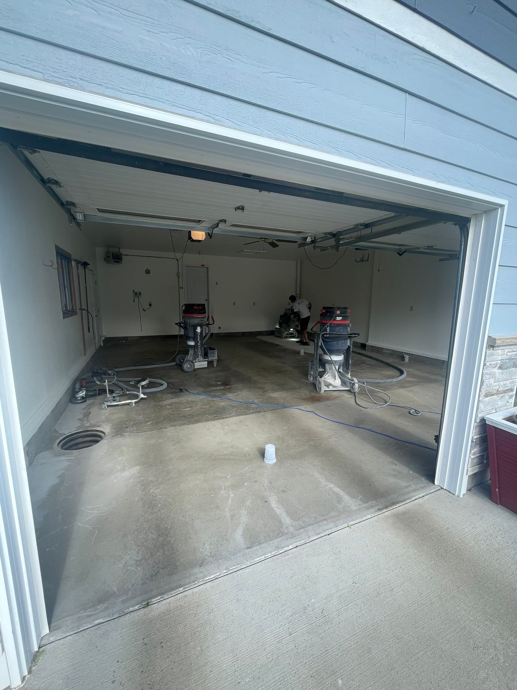Madison Garage Concrete Coating with Feather Grey Speckle Finish by Select Painting, Coatings & Garage Cabinets