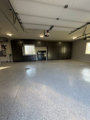 Yankton Garage Transformation with Dark Storage Cabinetry and Epoxy Flooring