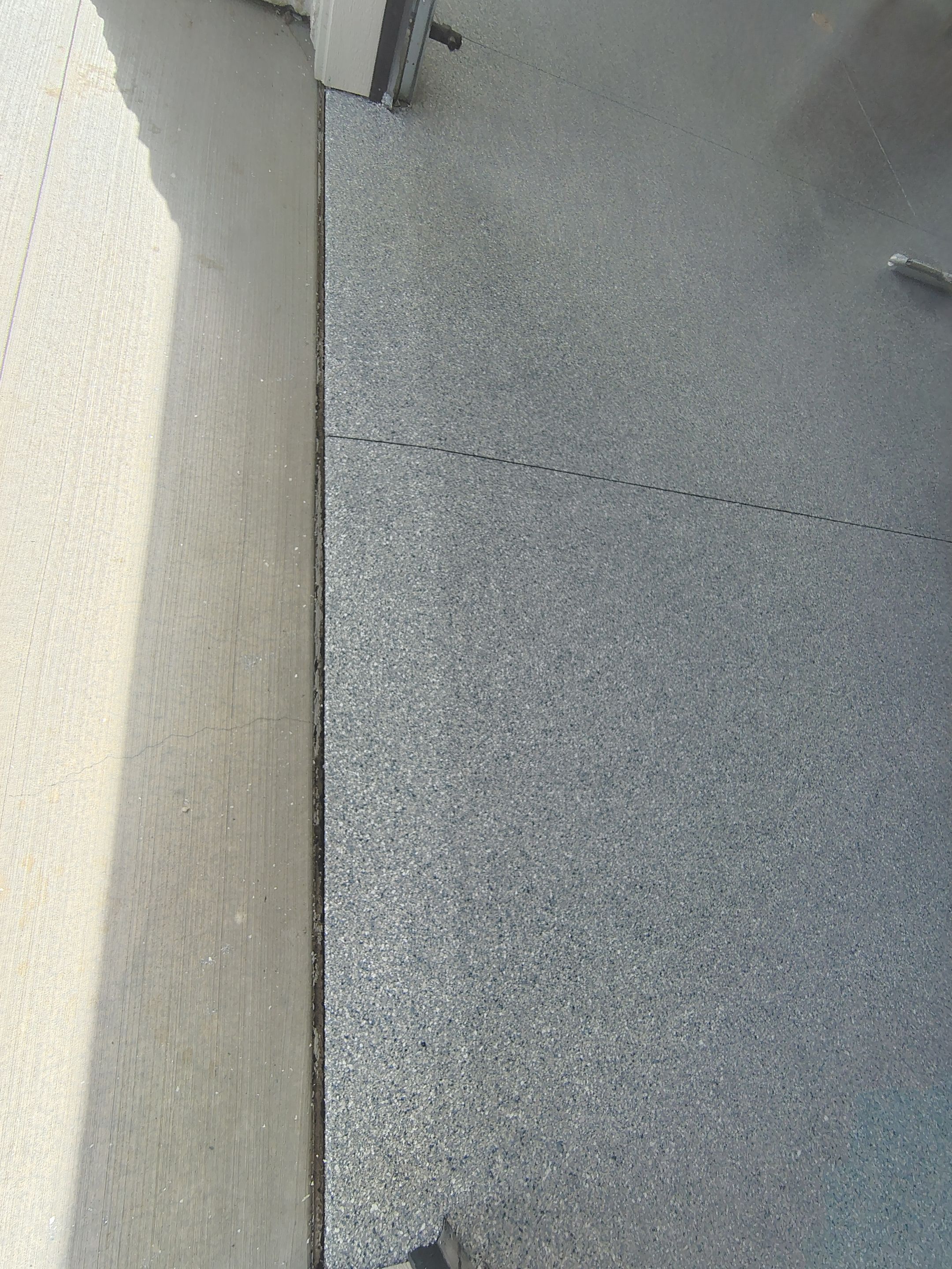 Sioux Falls Garage Floor Transformation with Gray Decorative Flake Coating by Select Painting, Coatings & Garage Cabinets