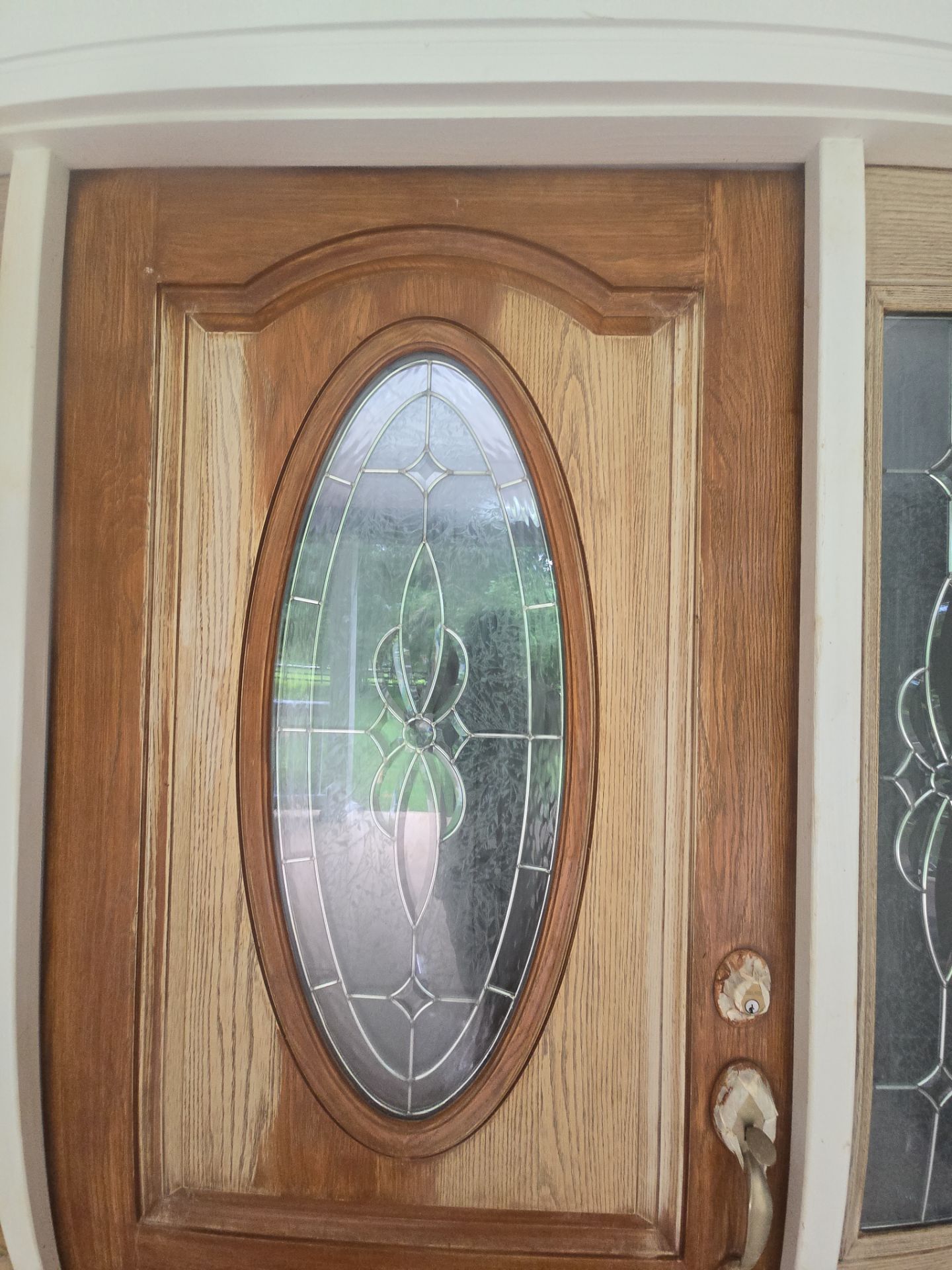 Siding replacement, exterior painting, and front door staining. by GonzalezPainters & Contractors Inc