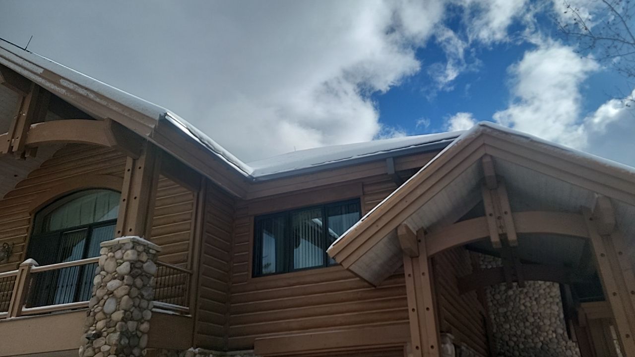 Standing Seam Metal Roof Replacement After Snow Damage by ASAP Roofing & Restoration