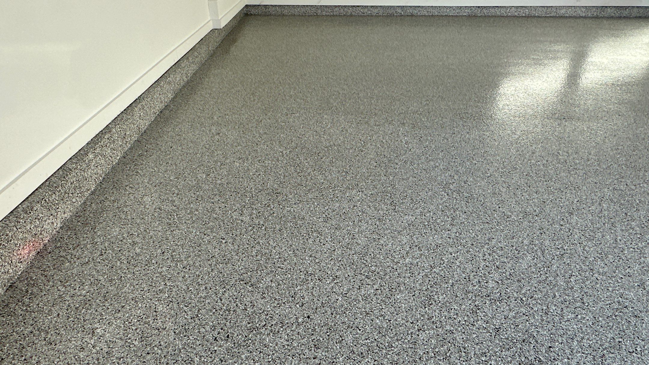 Mike M. got him self a beautiful Coyote flake floor by Banner Garage