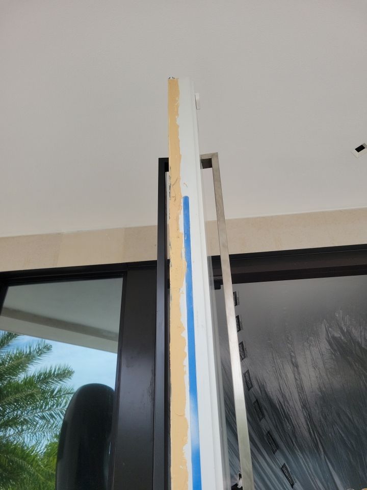 Custom Material Pivot Door installation by Impact Precious Wood Inc.