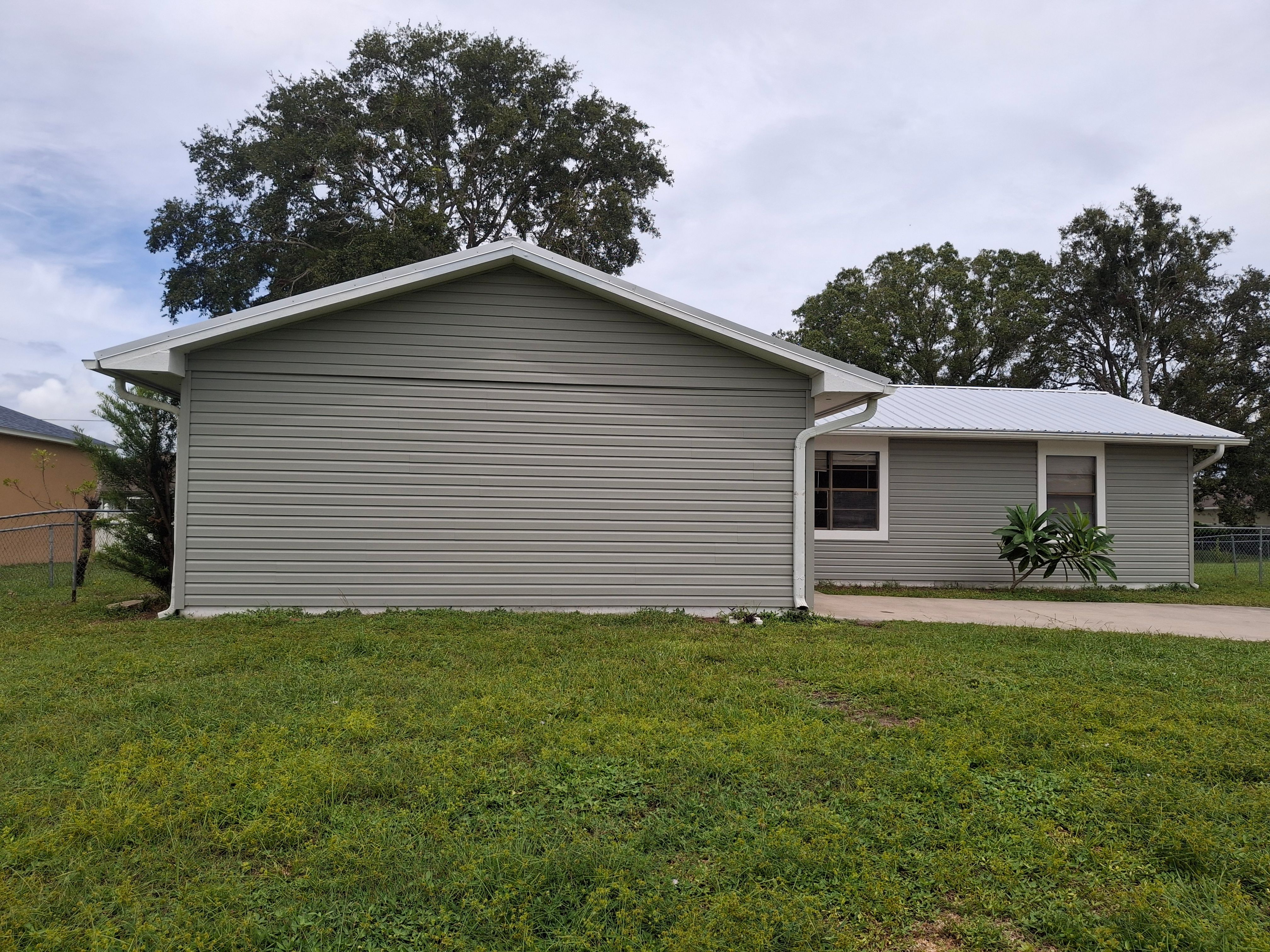 Vinyl Siding Installation and Structural Wood Rot Repair in Palm Bay by Florida Roofing and Renovations Inc.