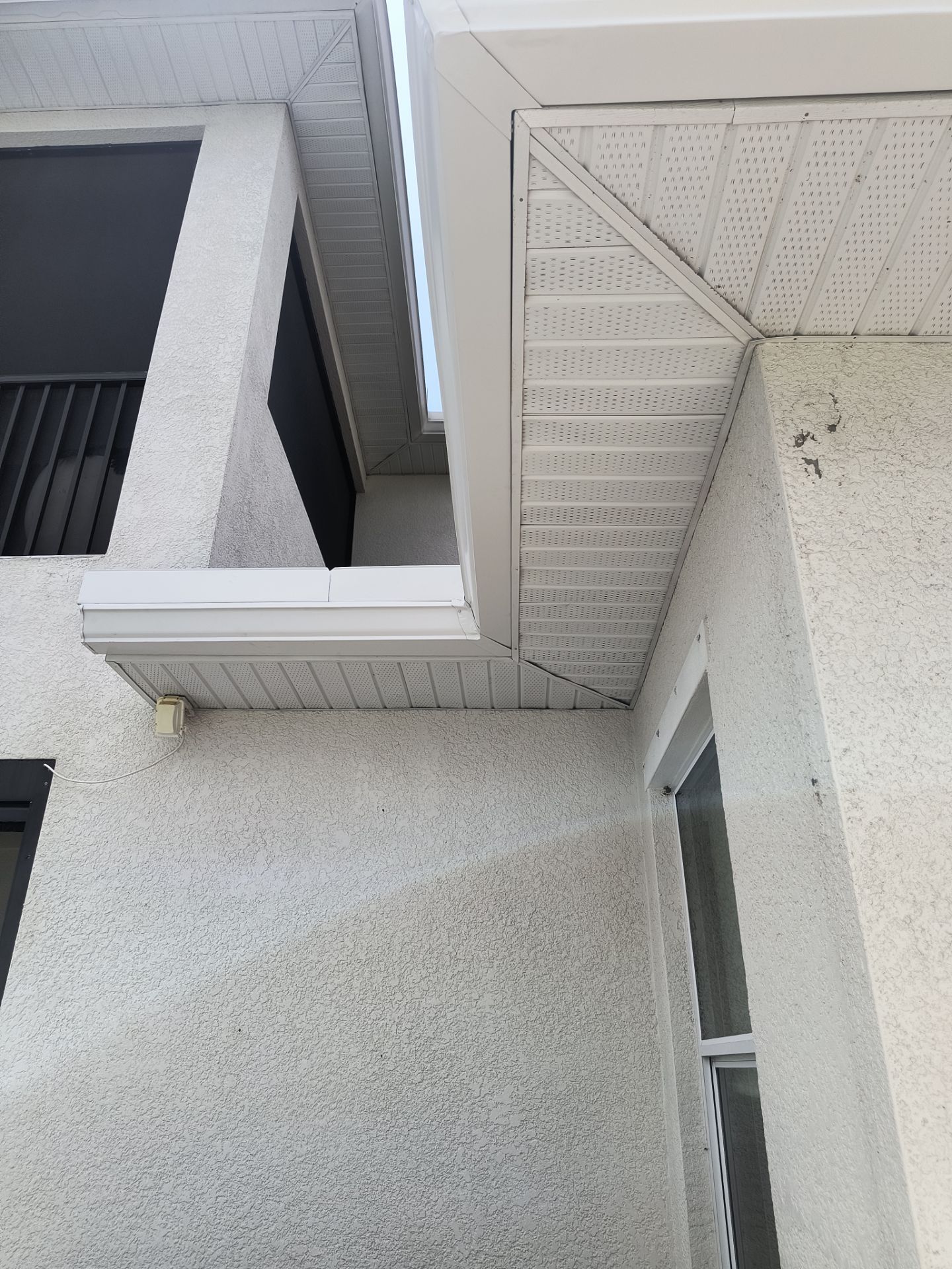 White Seamless Gutters with Downspouts in Bradenton FL by Gutter Professors