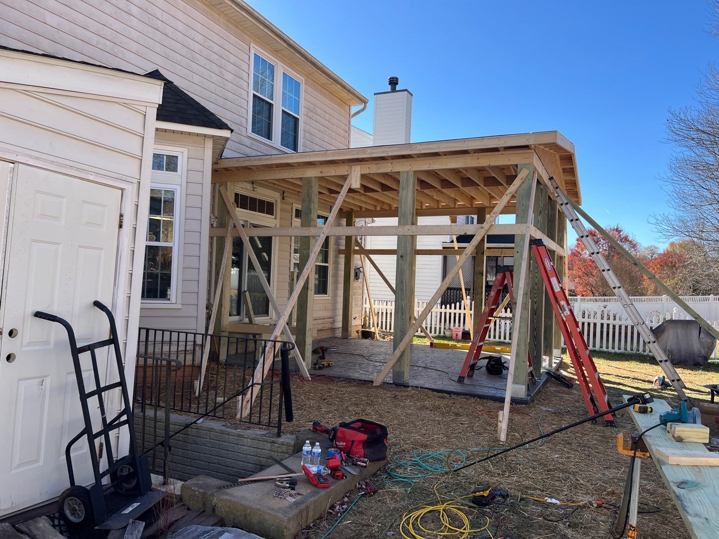 Custom Screened-In Porch with Stamped Concrete Patio in Warrenton by Jakari Restoration & Construction LLC