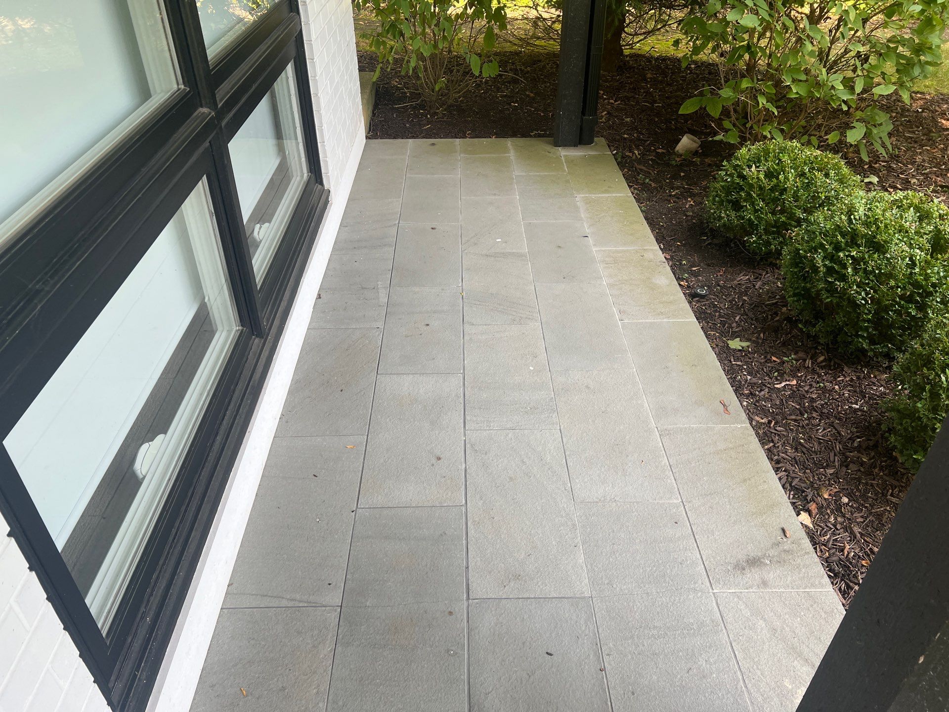 Complete Exterior House, Bluestone & Garage Floor Cleaning by Northern Power Washing LLC.