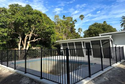Aluminum Fence Installation using Black 3 Rail Aluminum Fence