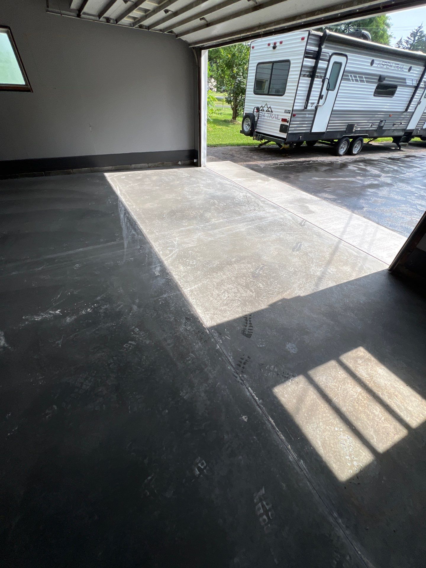 Concrete garage floor replacement and epoxy coating installed  by NG Masonry & Construction LLC