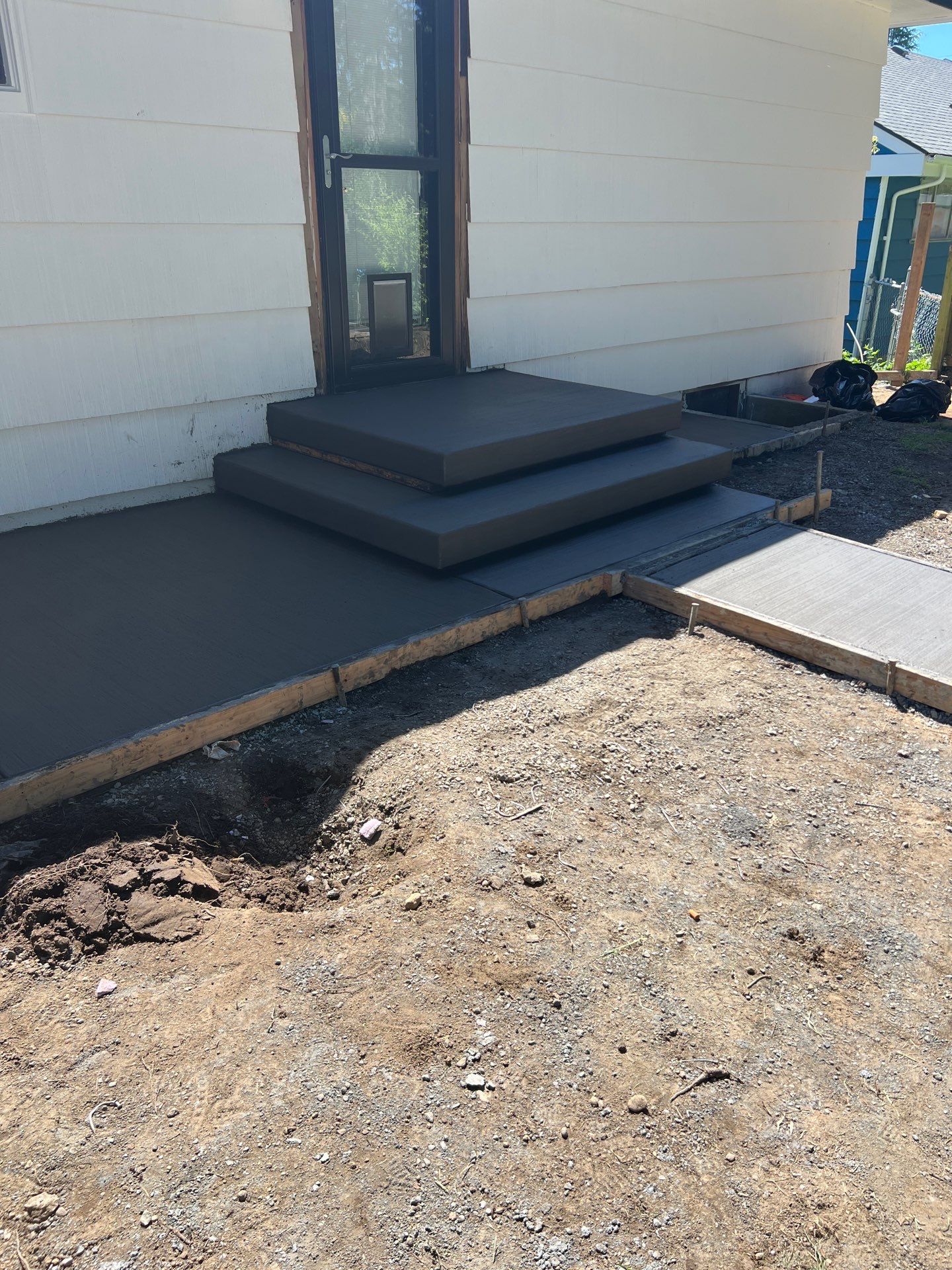 John | Concrete Backyard Walkway by Jireh Asphalt & Concrete Inc 