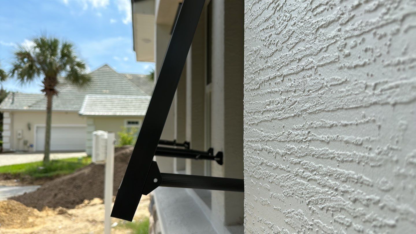 Bahama Shutters in Umbra Gray by Smart Guard Shutters