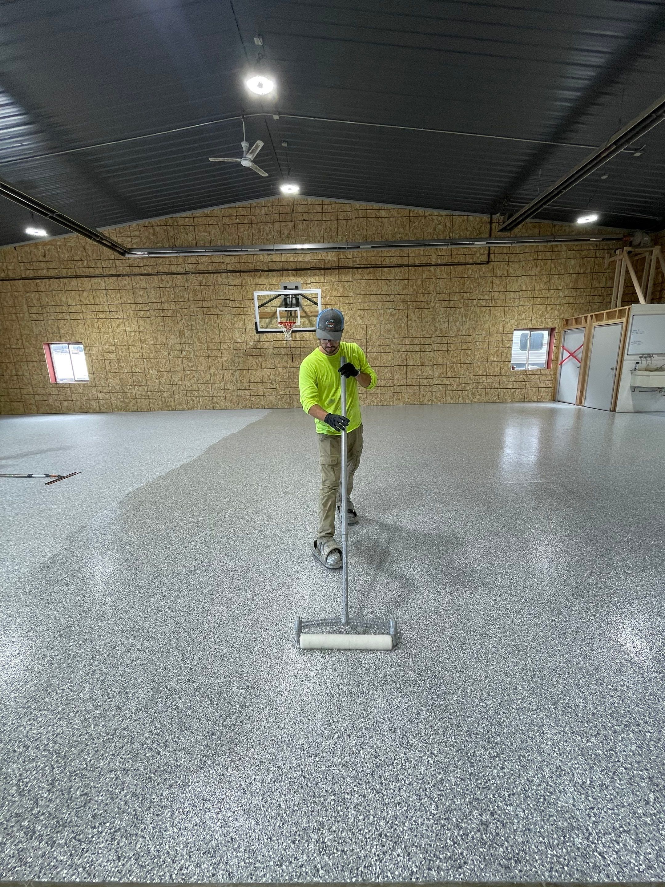 Custom Polyurea Shop Floor with Basketball Court Lines in Rock Valley by Select Painting, Coatings & Garage Cabinets
