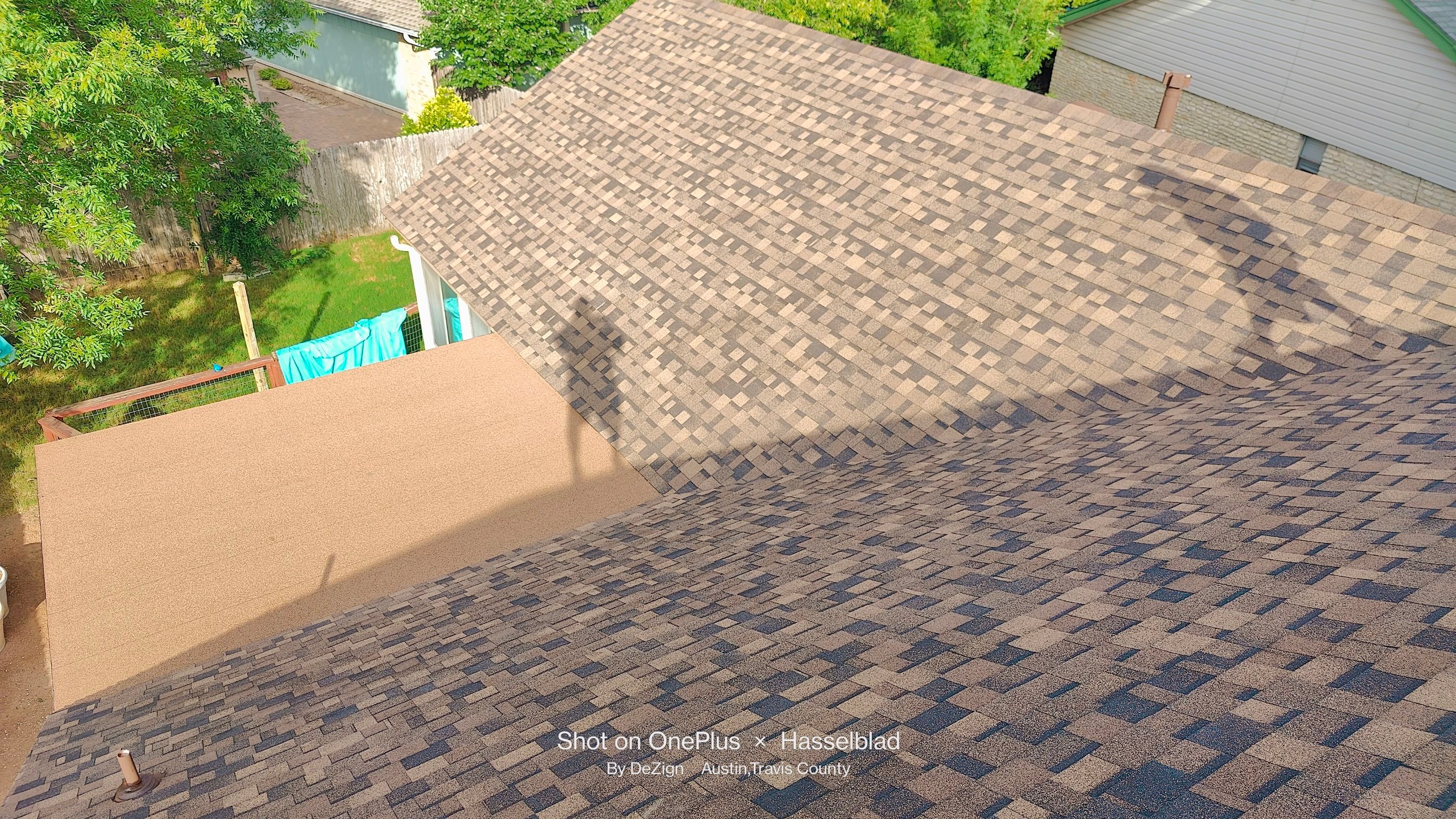 New Roof Installation Of IKO Dynasty Color Brownstone by DeZign Roofing & Exteriors