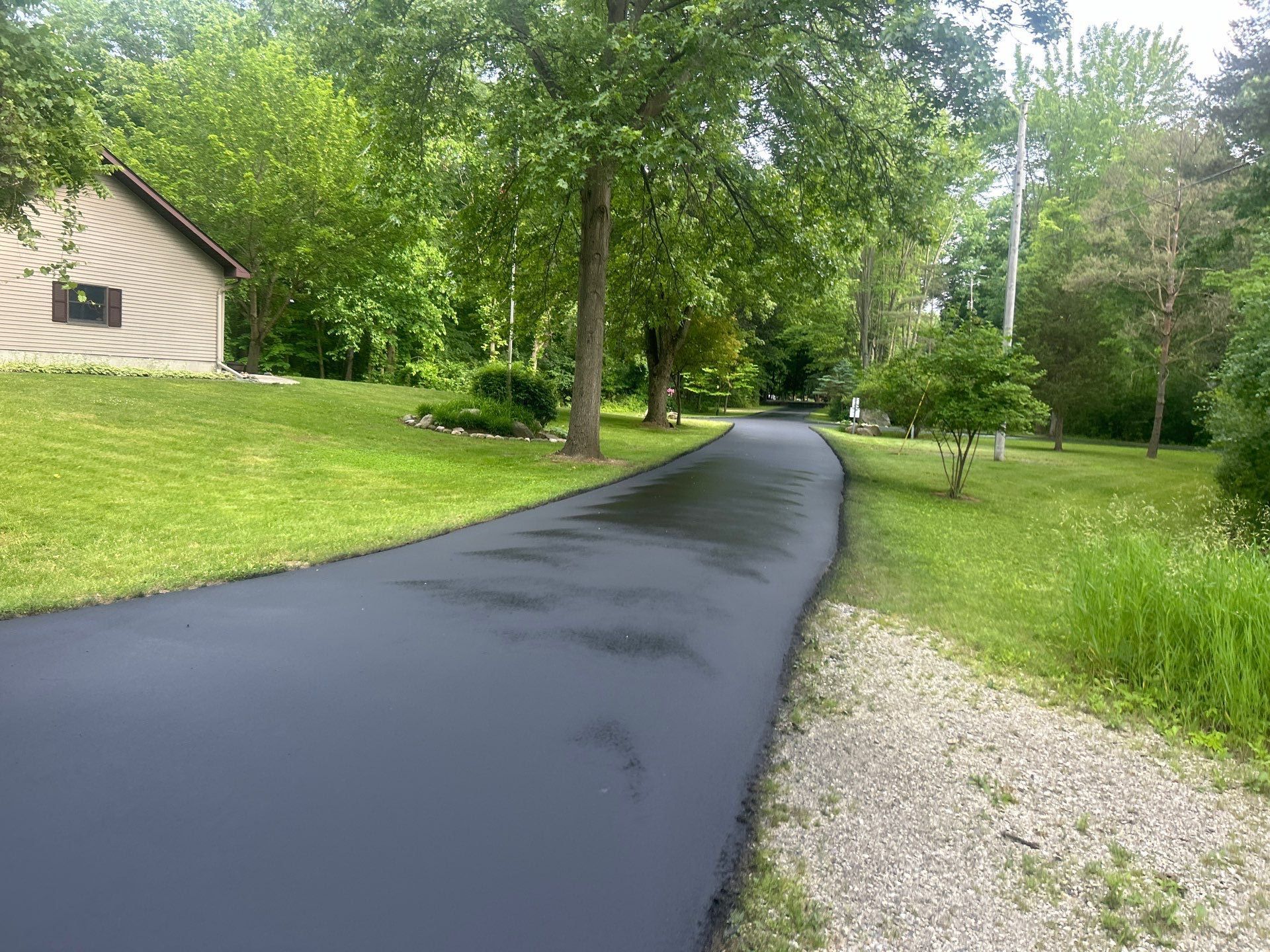 High end residential driveway by Quality Asphalt & Maintenance LLC