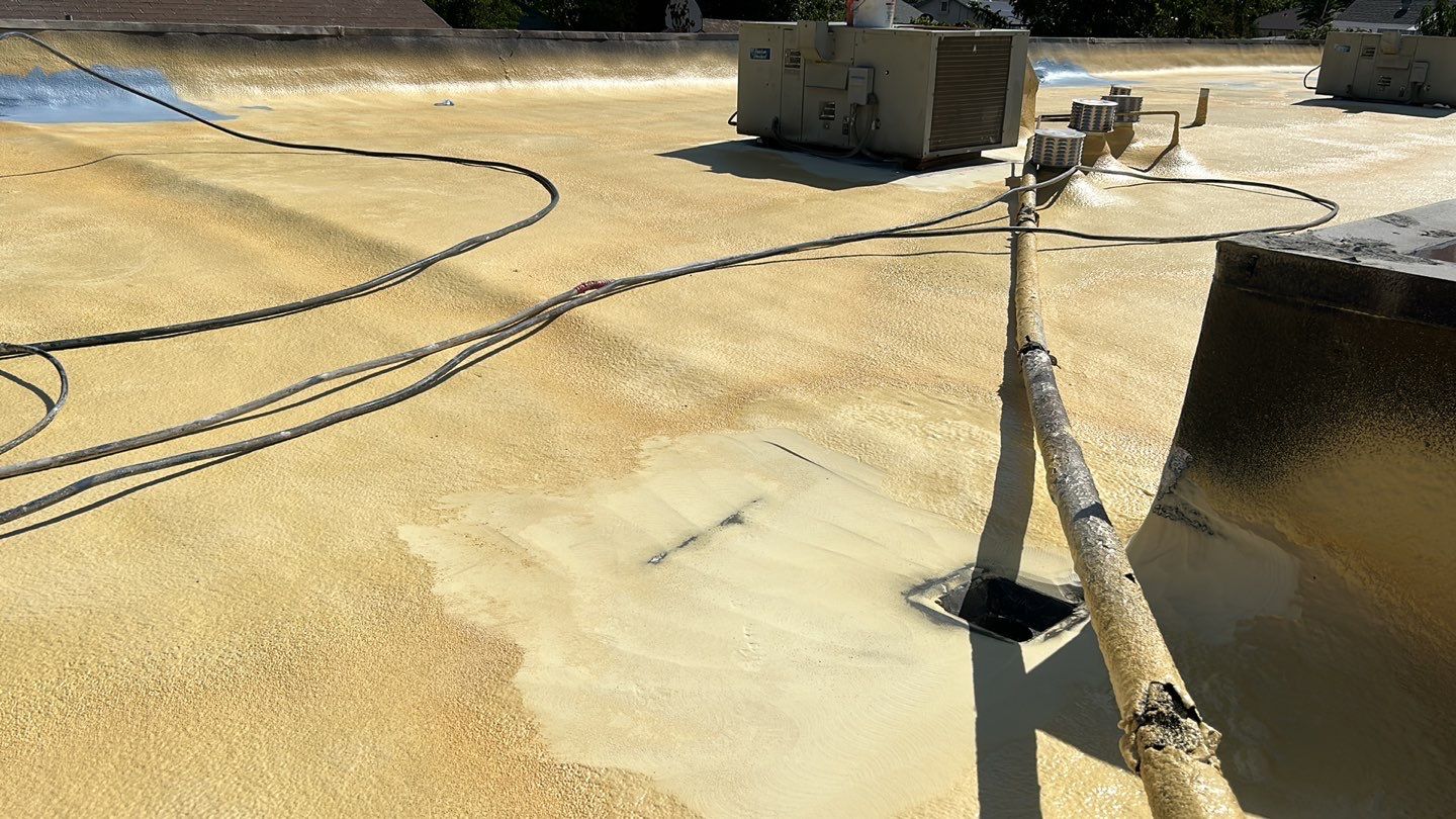 Foam Refurbish using Conklin Benchmark/PUMA XL coatings and spray foam; Also metal roofing around parapet wall by Straight Edge Roofing Inc