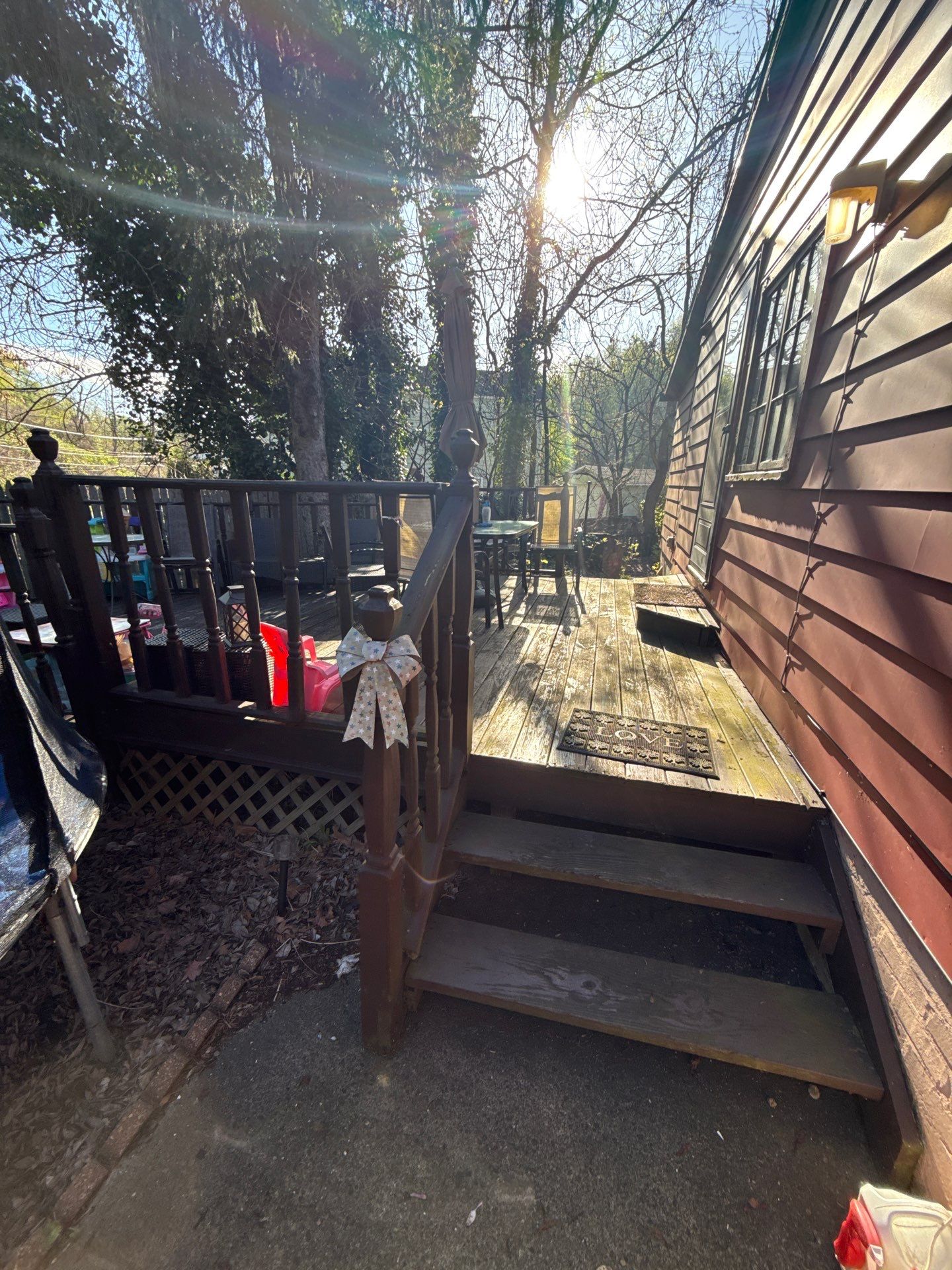 Roof sunspace deck  by Cousins Roofing Siding & Decks