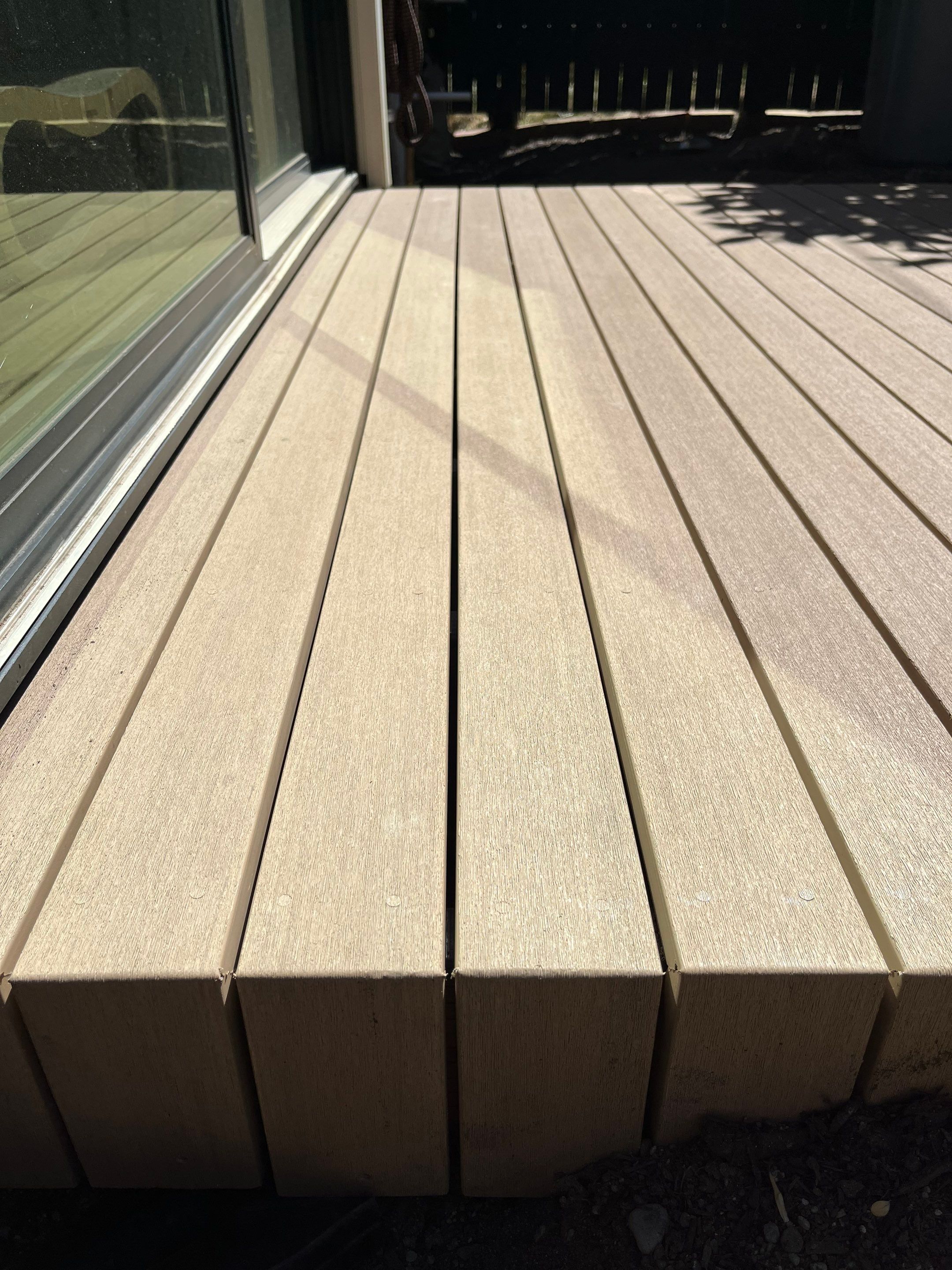 Modern Backyard Deck by Alki deck builders 