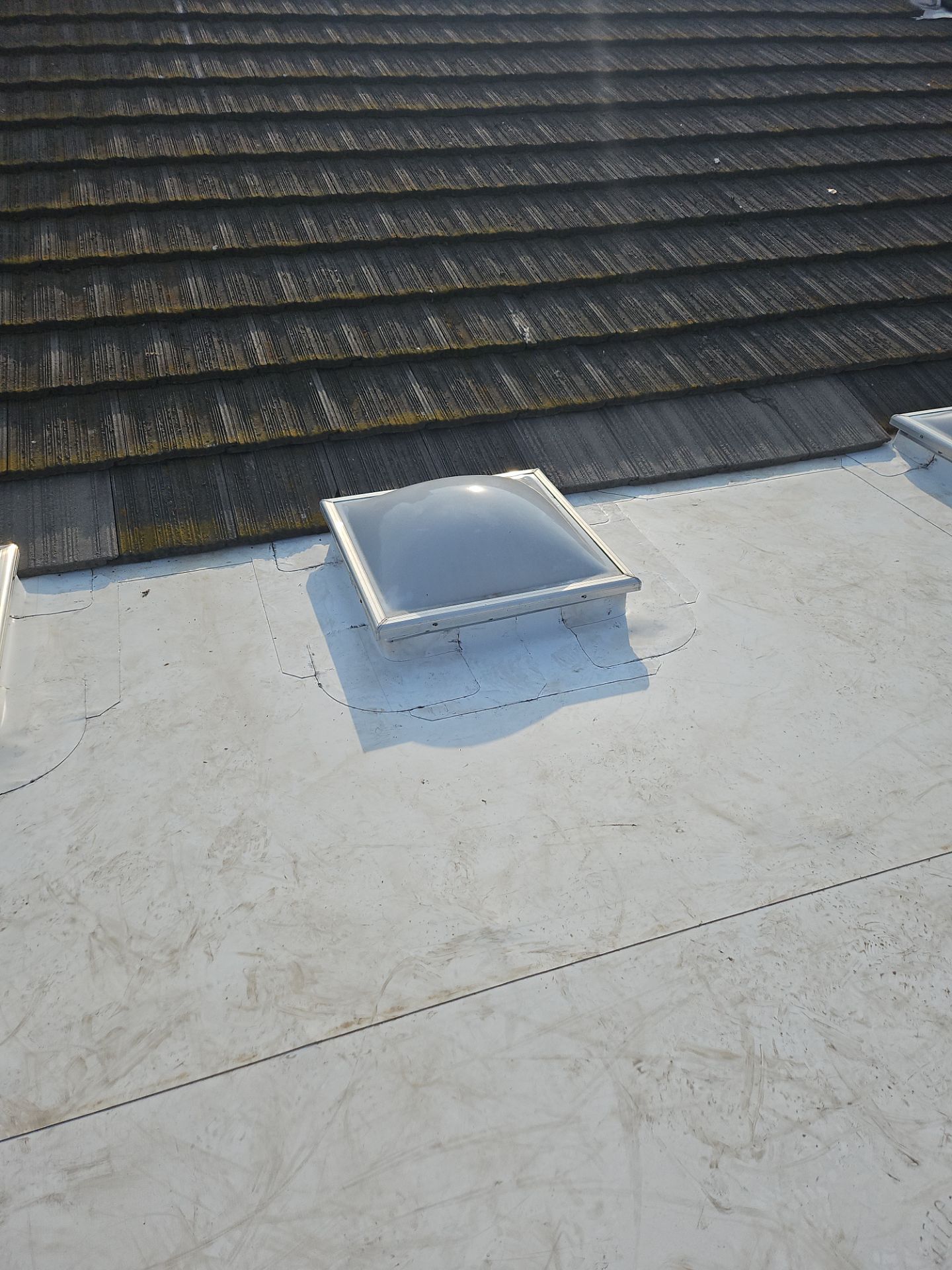 Single-ply roofing system on porch using TPO 60 mil by Straight Edge Roofing Inc