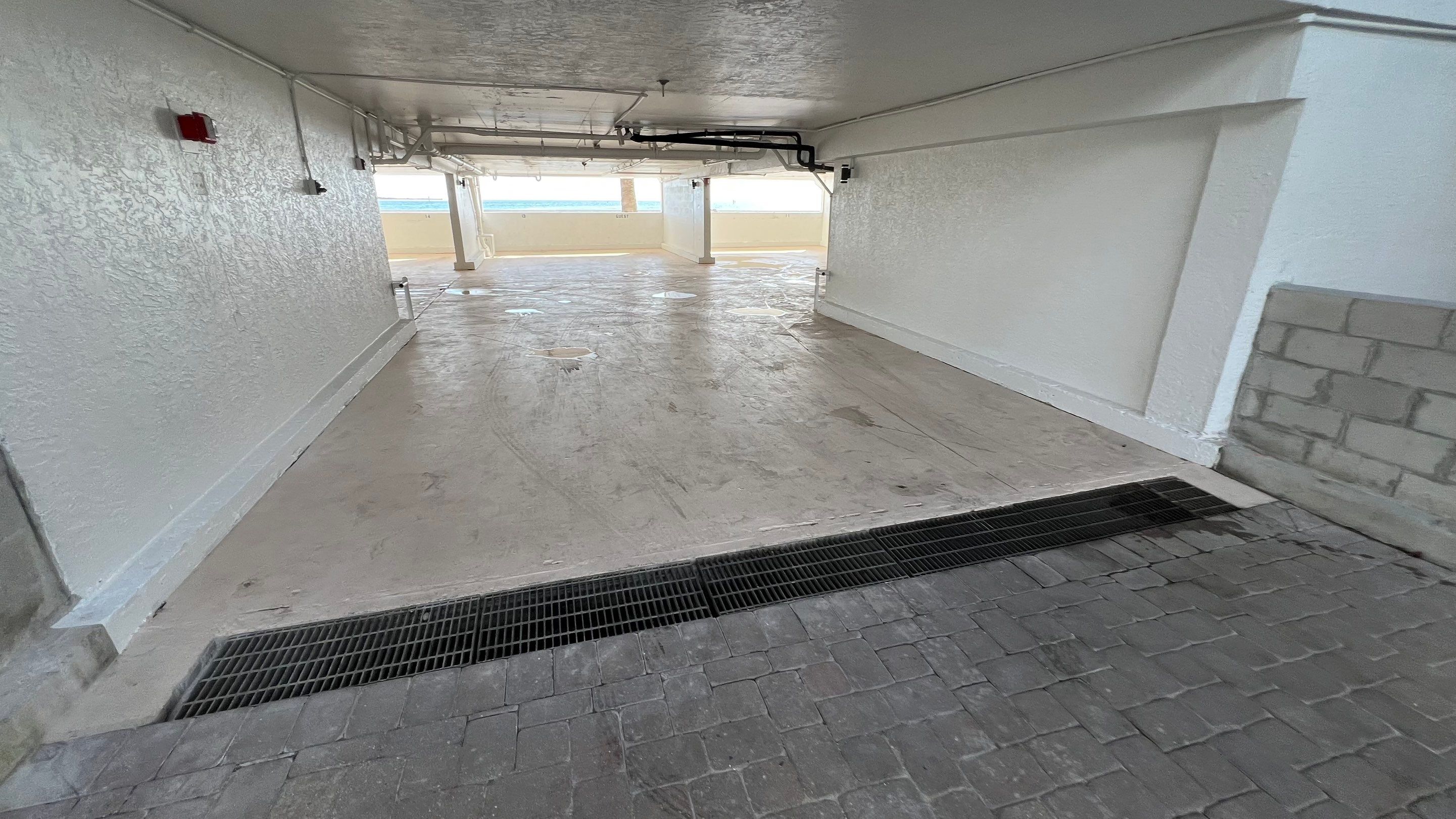 Isles of Capri Condo Parking Garage Drainage System Cleaning by APS Power & Water