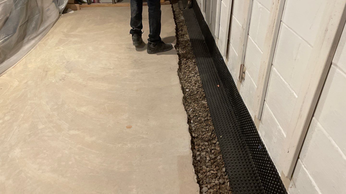 Interior Drain Tile & Buried Discharge in St. Anthony, MN by Waterproofing Northeast