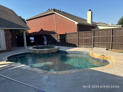 Freeform Pool and Spa with Raised Stone Water Wall