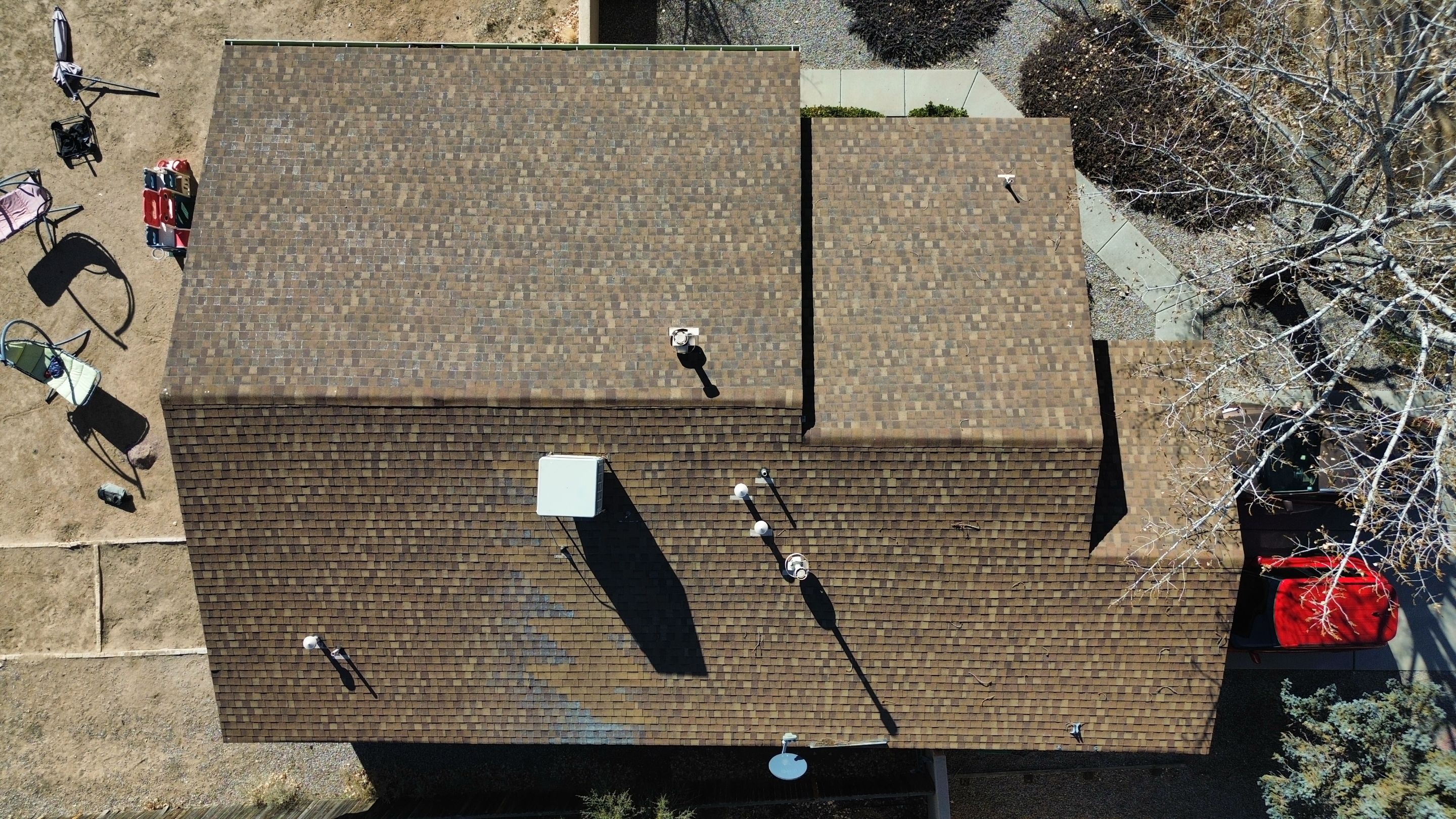 Oakridge Desert tan shingles in Chimayo Meadows by Doyle Roof Masters Inc