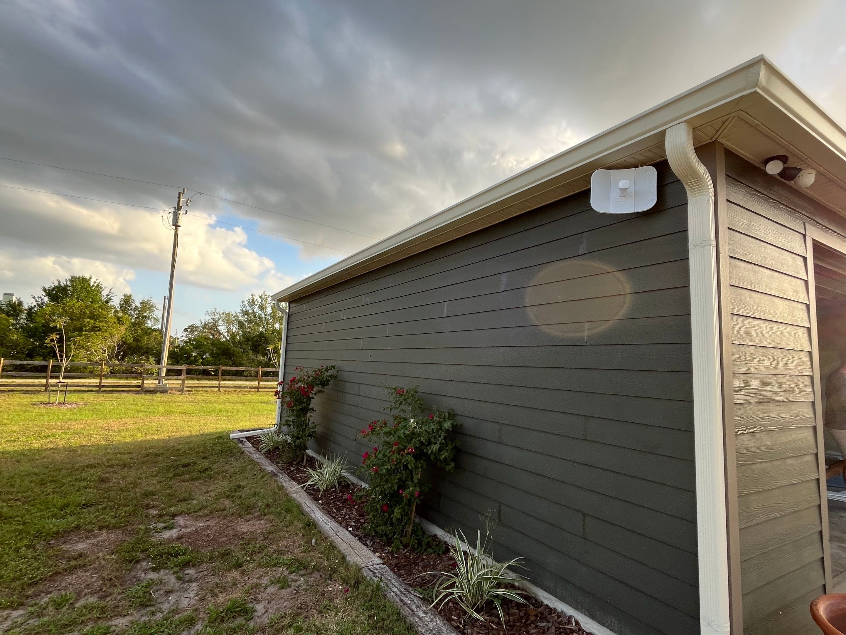  7-inch White seamless gutters and downspouts in Myakka City FL by Gutter Professors