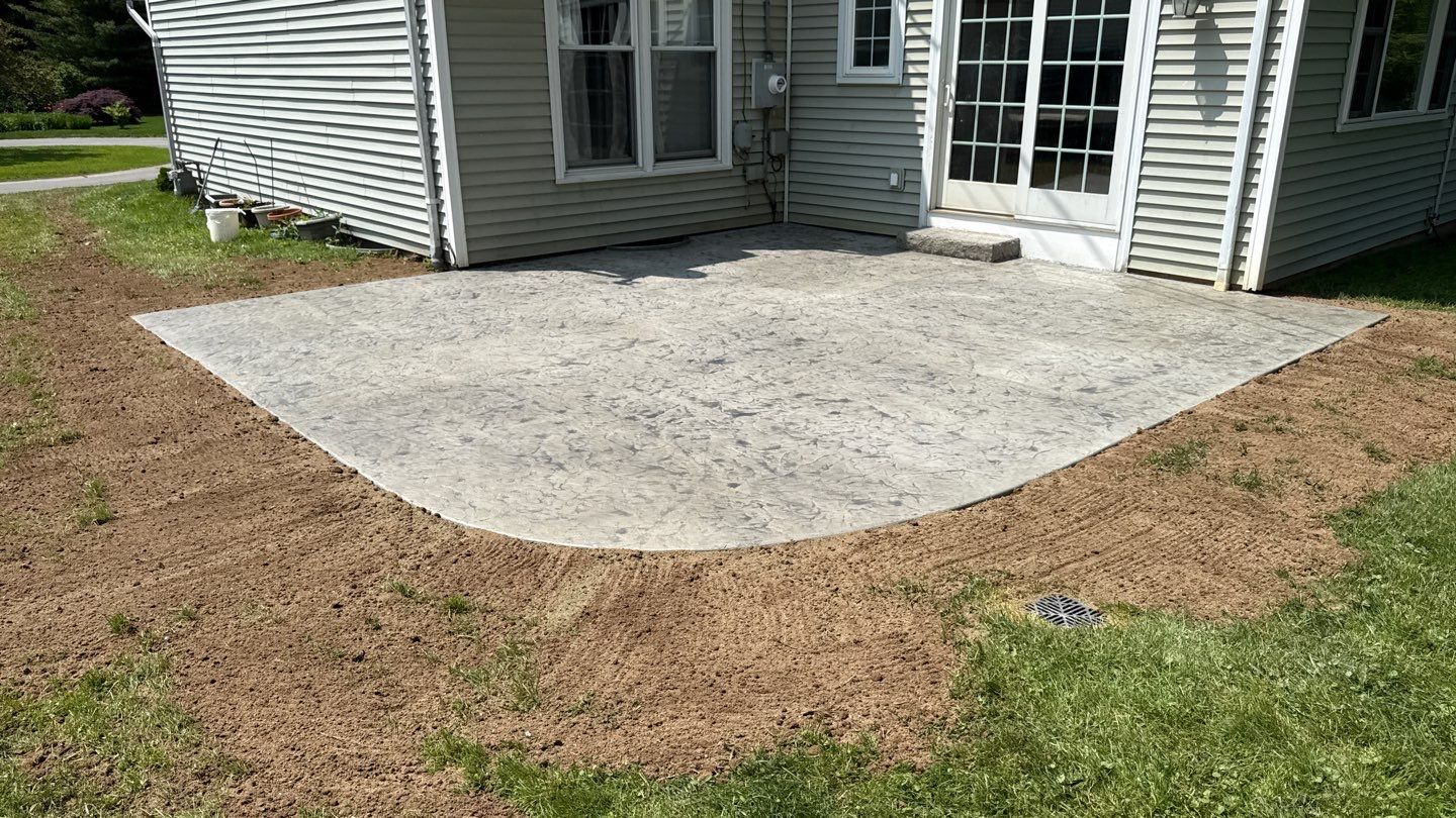 Oxford slate stamped patio  by NG Masonry & Construction LLC