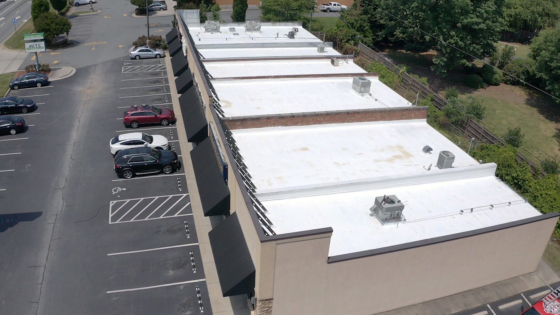 Commercial Roof Coating using Fiberseal basecoat and Silicon Topcoat by Just In Time Roofing and Restoration