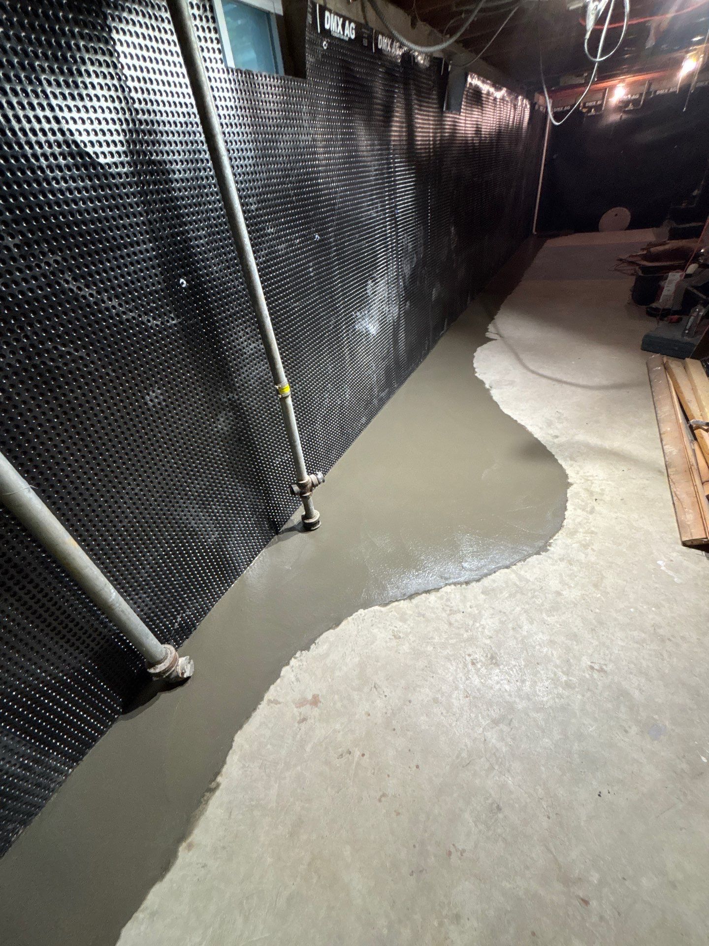 Interior Drain Tile & Buried Discharge in South Minneapolis by Waterproofing Northeast