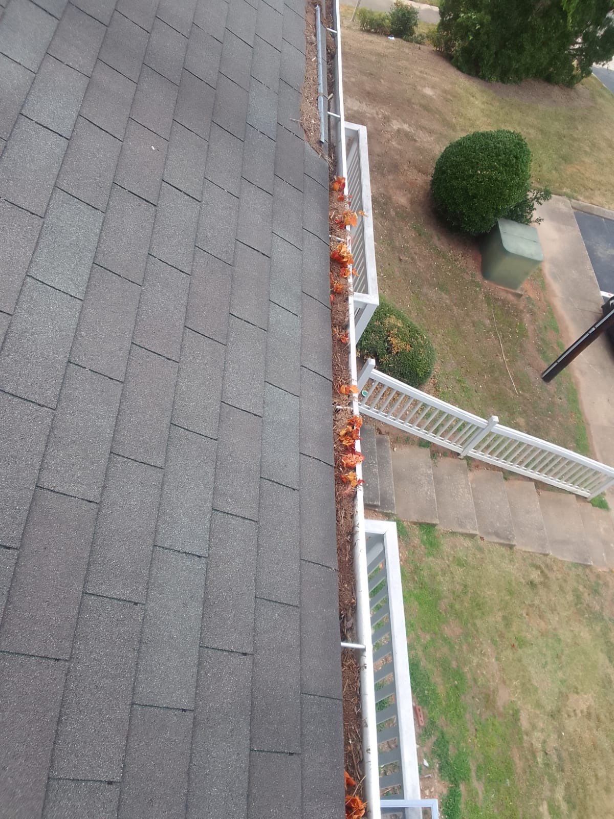 Commercial gutter cleaning Wake Forest & Rolesville, NC before photo with filled gutters