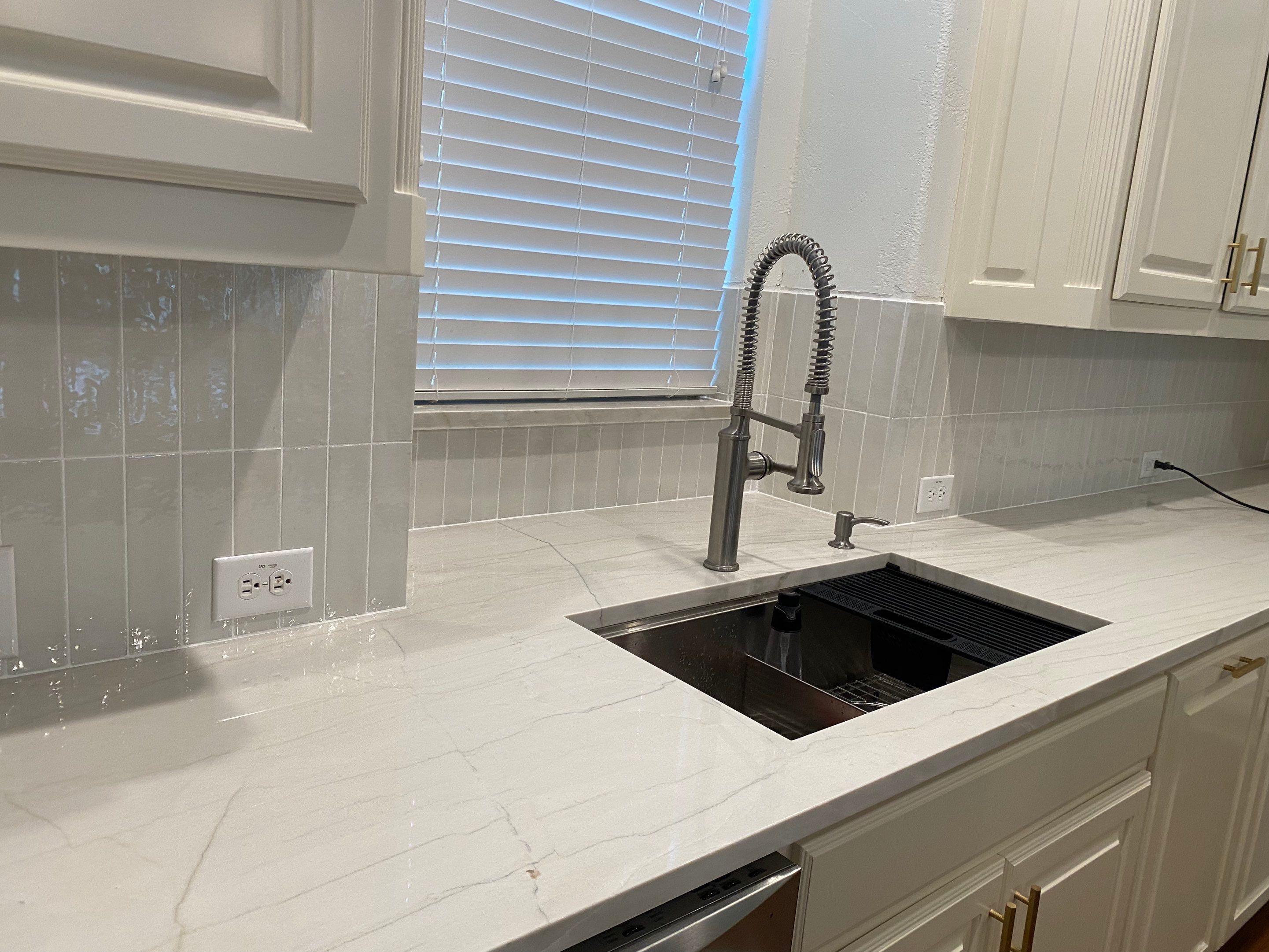 Kitchen Remodel using Quartzite by SLM General Contractors & Roofing
