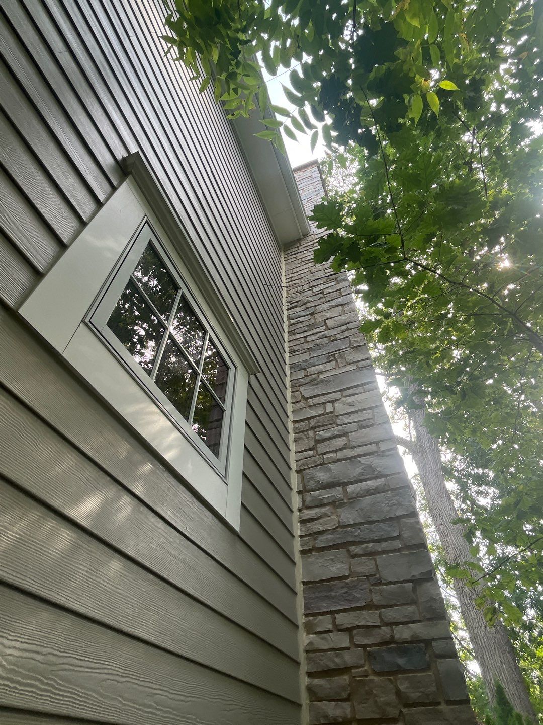 Hardie Board House & Detached Garage Soft Washing by Northern Power Washing LLC.