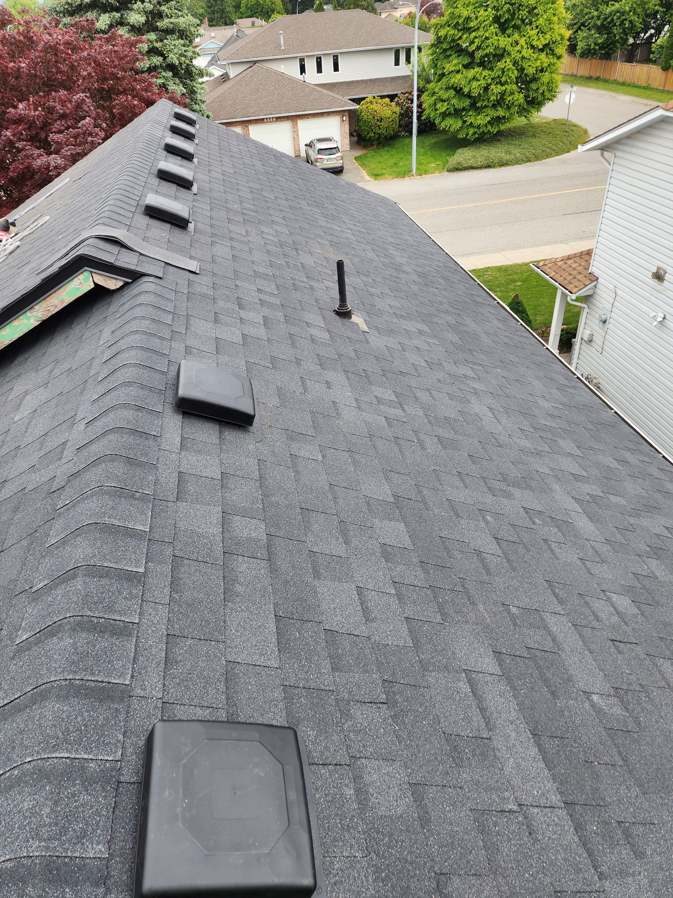 Residential Cedar ReRoofing Installation using OC Oakridge shingles by Top Notch Roofing Inc