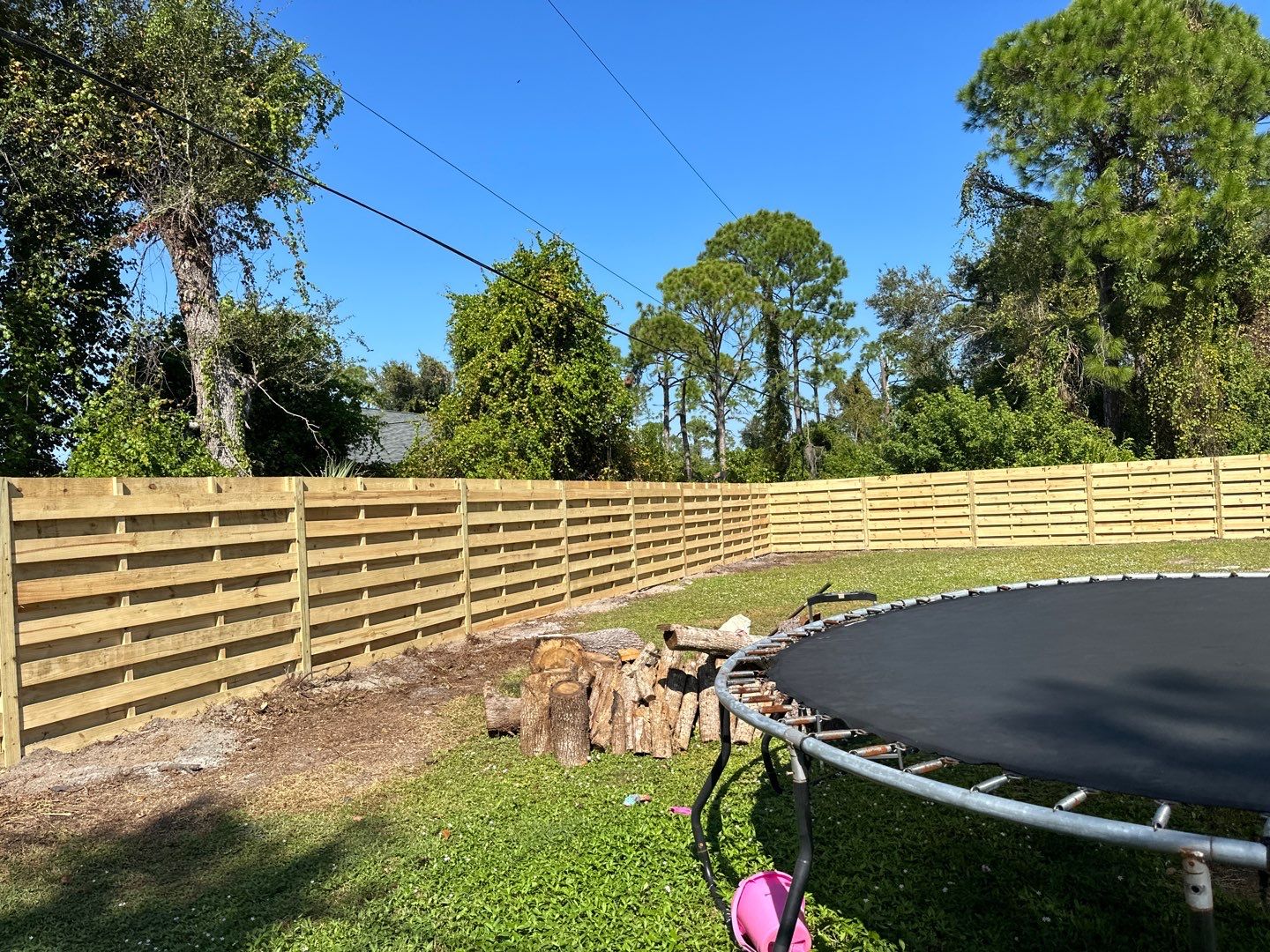 Wood Fence Installation using 6 Ft. Tall Pressure Treated Wood Shadowbox Fence by Asap fence and gates, LLC