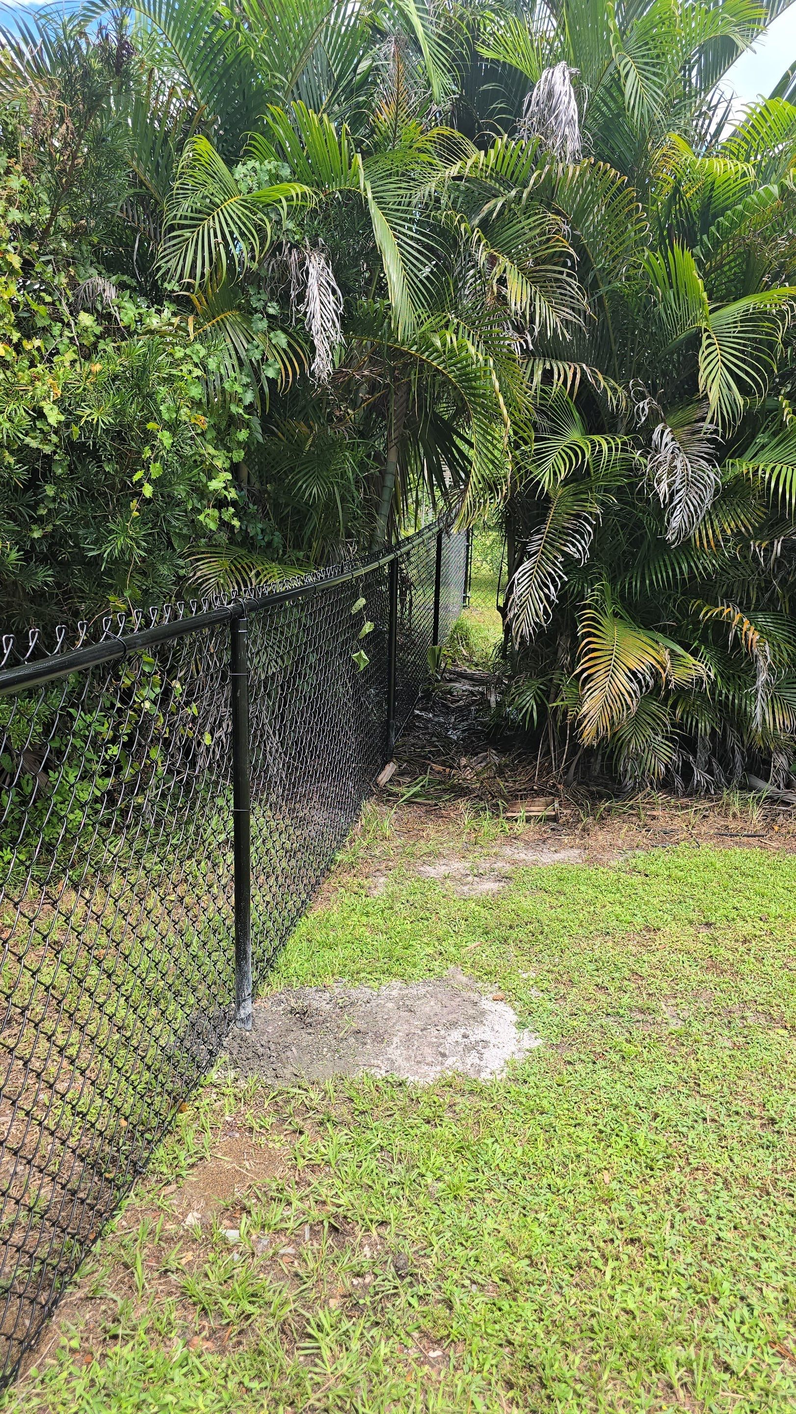 Black Chain Link Perimeter Fencing for North Port Residential Property by True Fence LLC