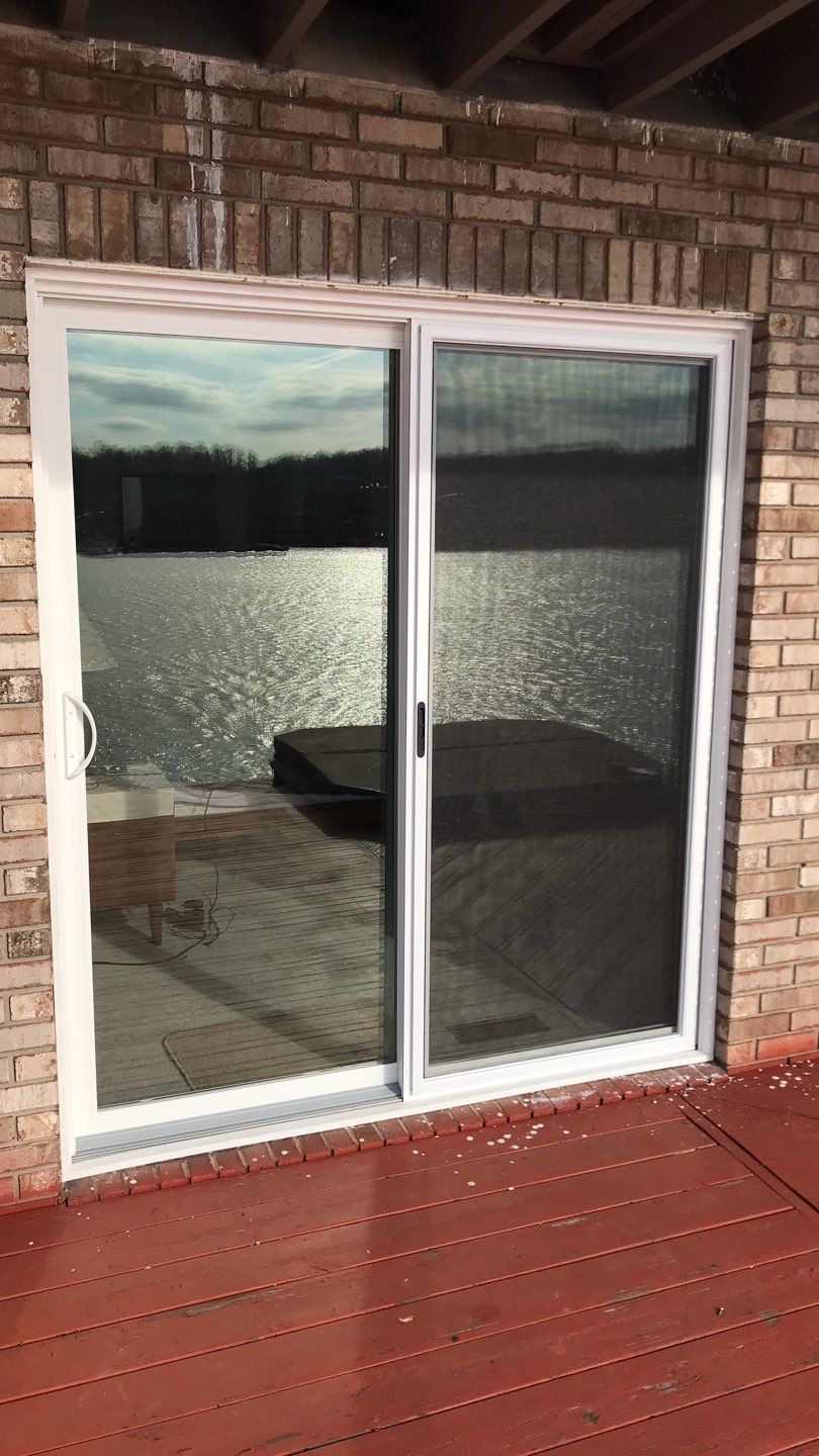Deck Refurbush and Door Replacement using Trex Decking and Railing.  Polaris Patio Doors by Secure Construction Company Inc