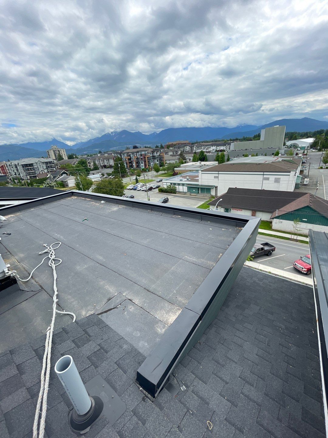 Large apartment with sbs, shingles and prolok metal  by Top Notch Roofing Inc