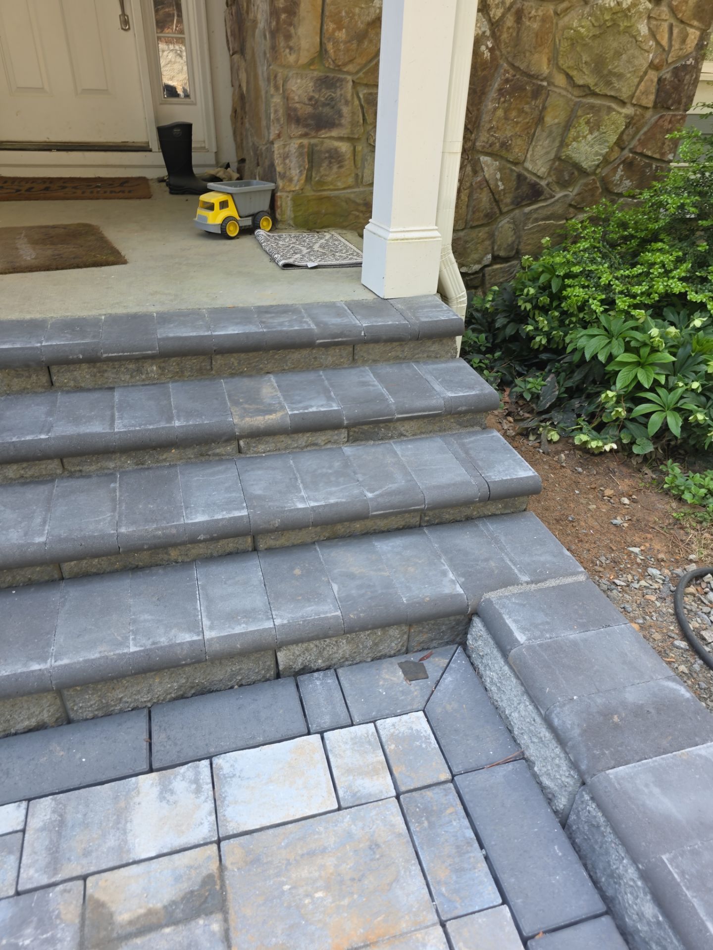 Pittsboro Outdoor Living Transformation – Retaining Wall, Paver Patio & Elevated Deck by Elite Remodeling and Design LLC