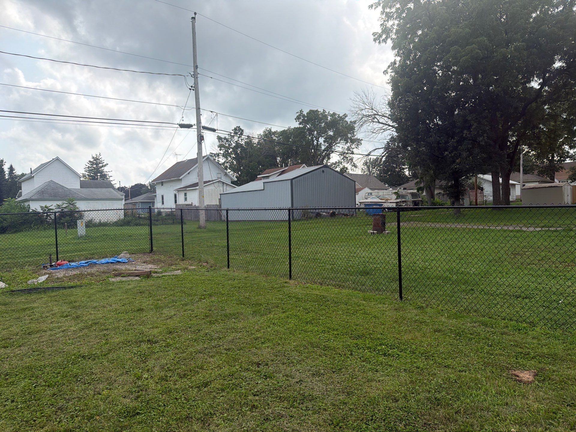 Residential Black Chain Link Fence Installation in Reinbeck by Perfect Picket Fence and Stain