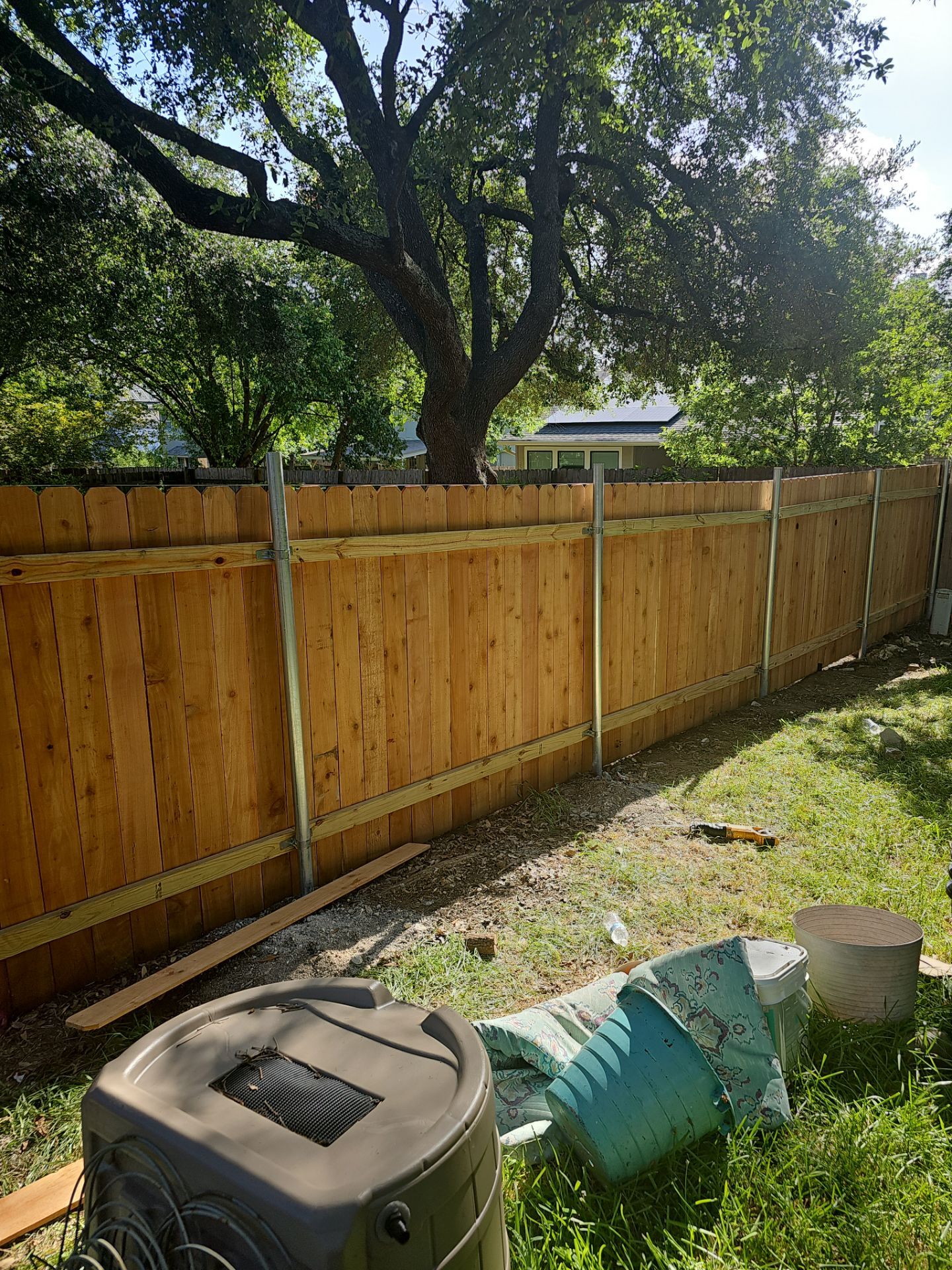 Fence Installation using Cedar Pickets by DeZign Roofing & Exteriors