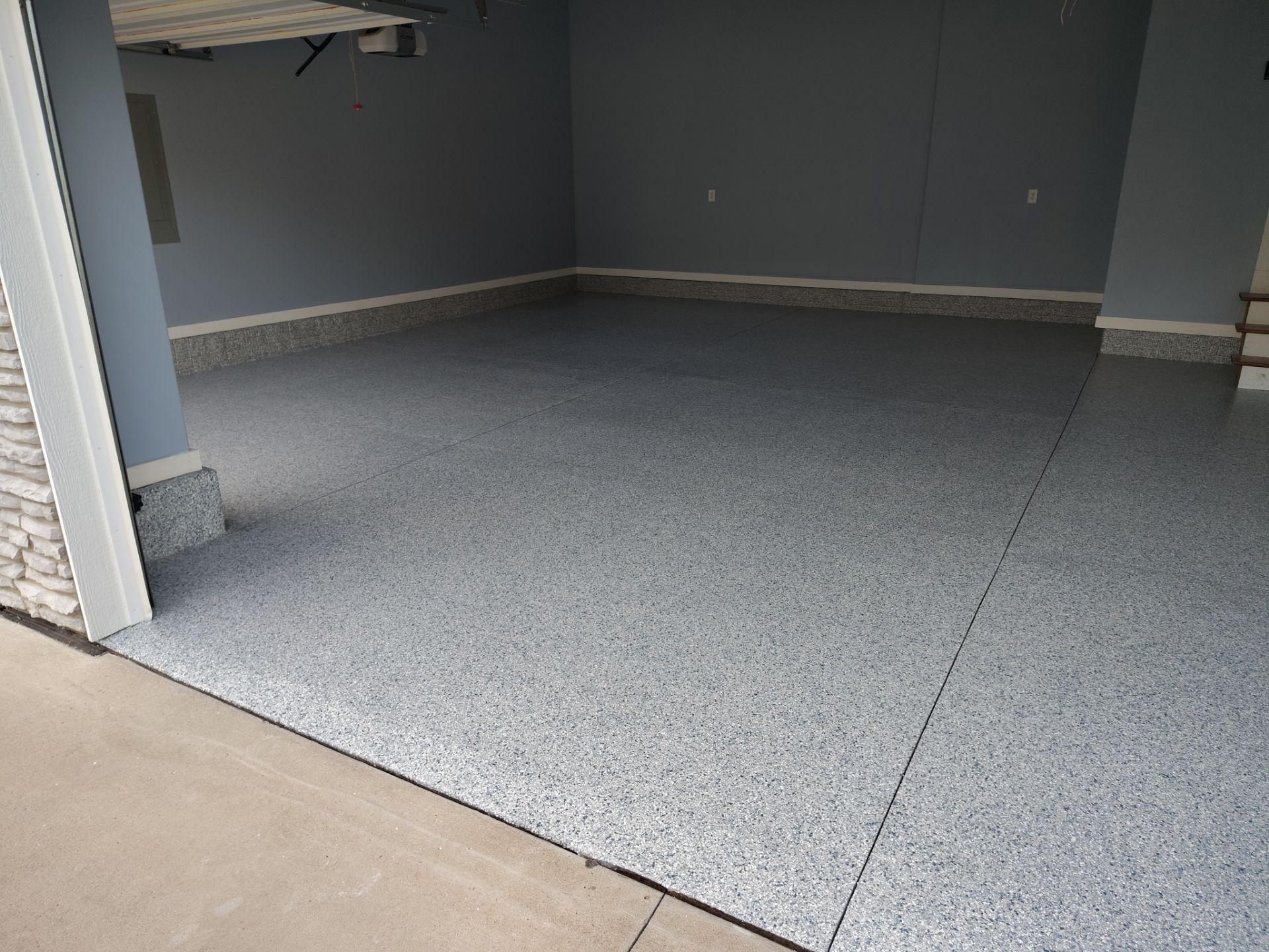 Tidal Wave Garage Transformation in Adel, Iowa by Revival Concrete Coatings