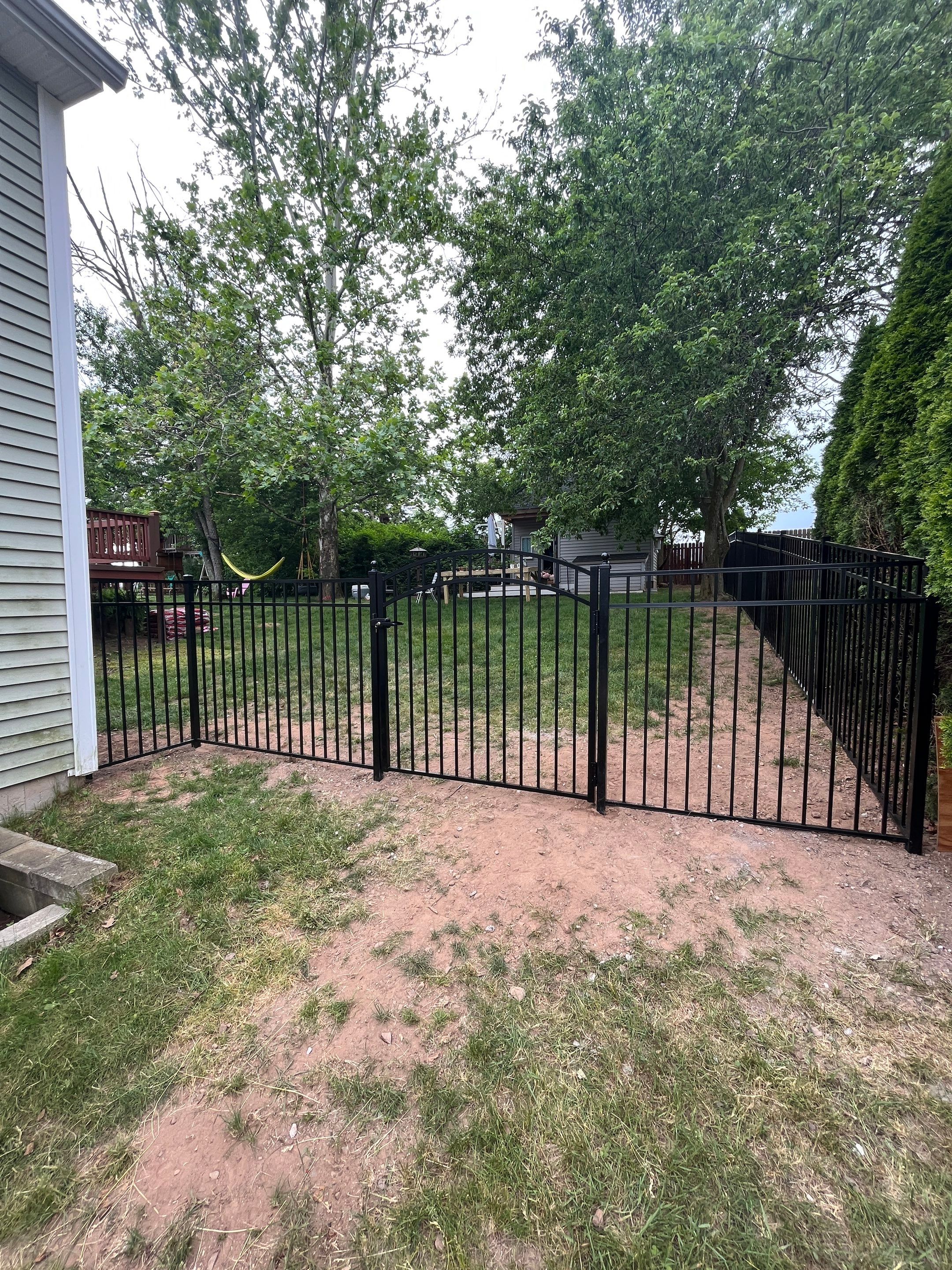 Aluminum Fence in Black, with matching Arched gate by DiGiorgi Roofing and Siding Inc