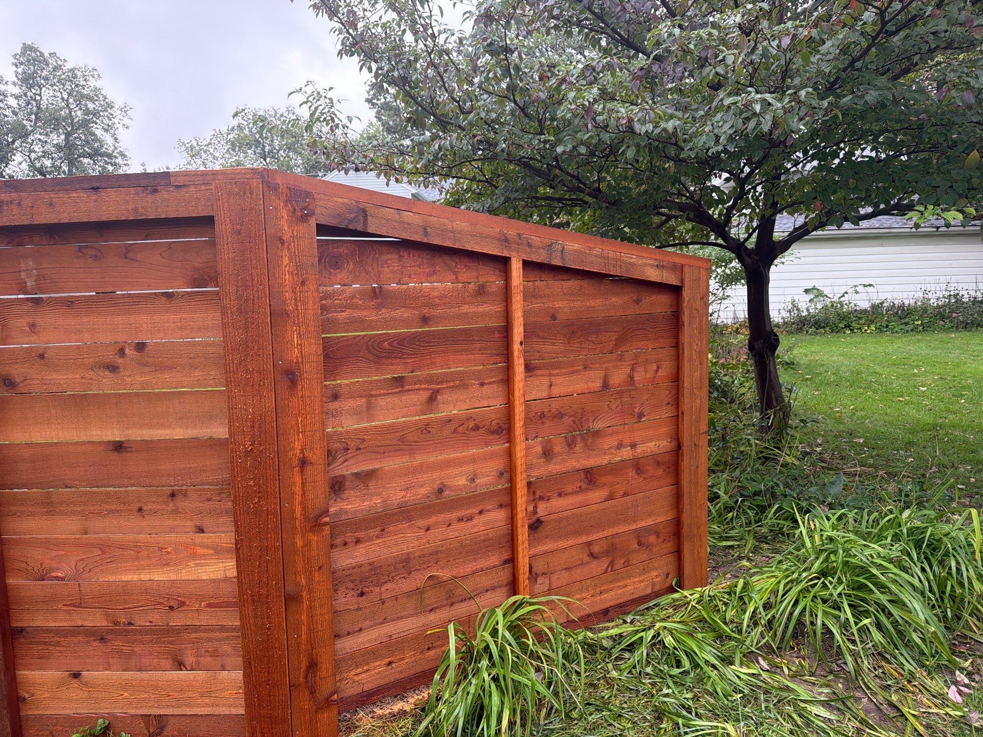Stained Horizontal Cedar Wood Privacy Fence in Cedar Falls by Perfect Picket Fence and Stain