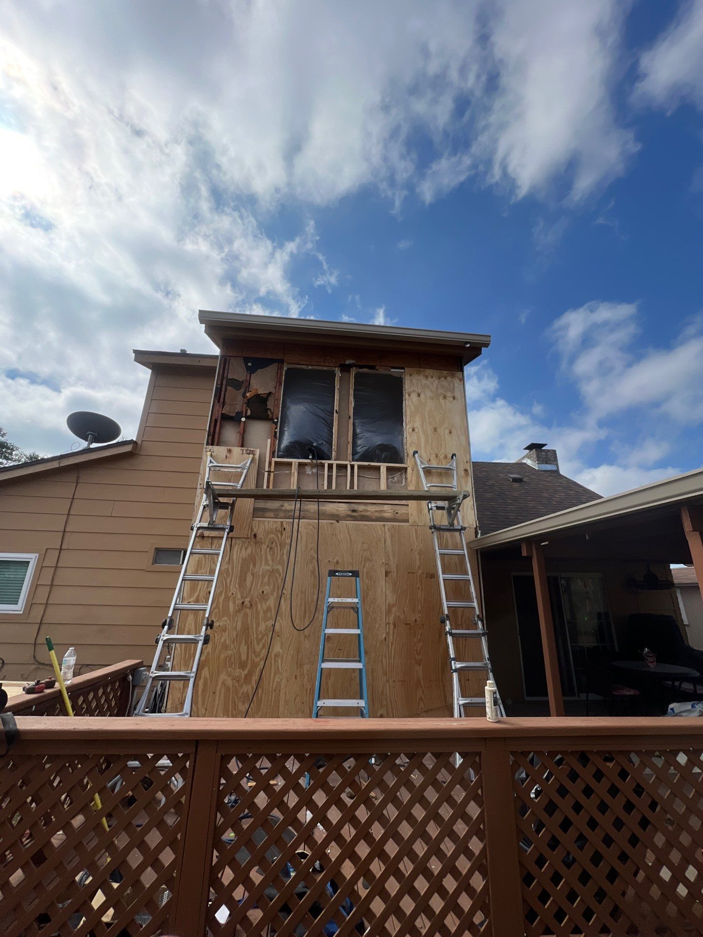 Installing Windows on a Submarine  by Bayfront Roofing and Construction