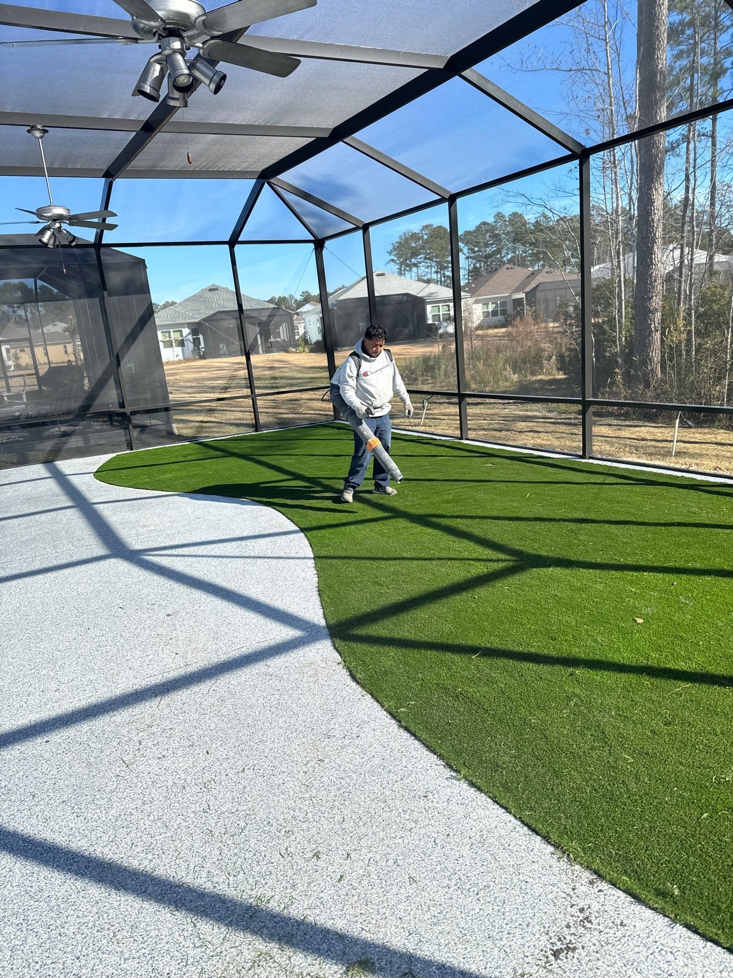 Hardeeville Screened-In Concrete Patio and Integrated Artificial Turf by Lowcountry Scapes, LLC
