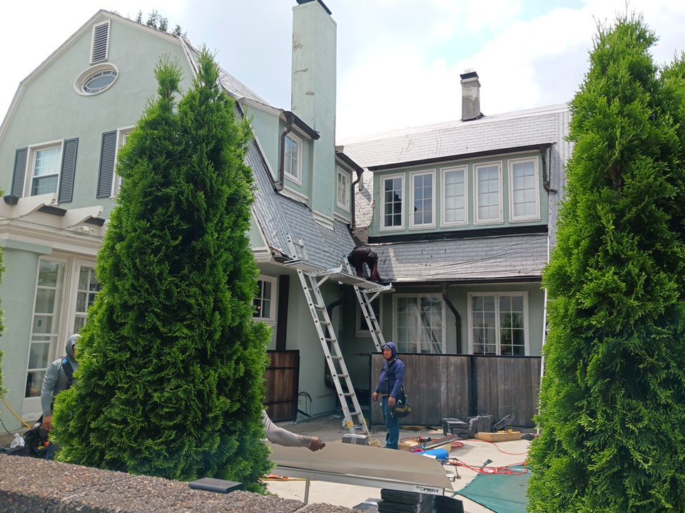 Slate removal/Cedar Shake replacement by Storm Contracting 