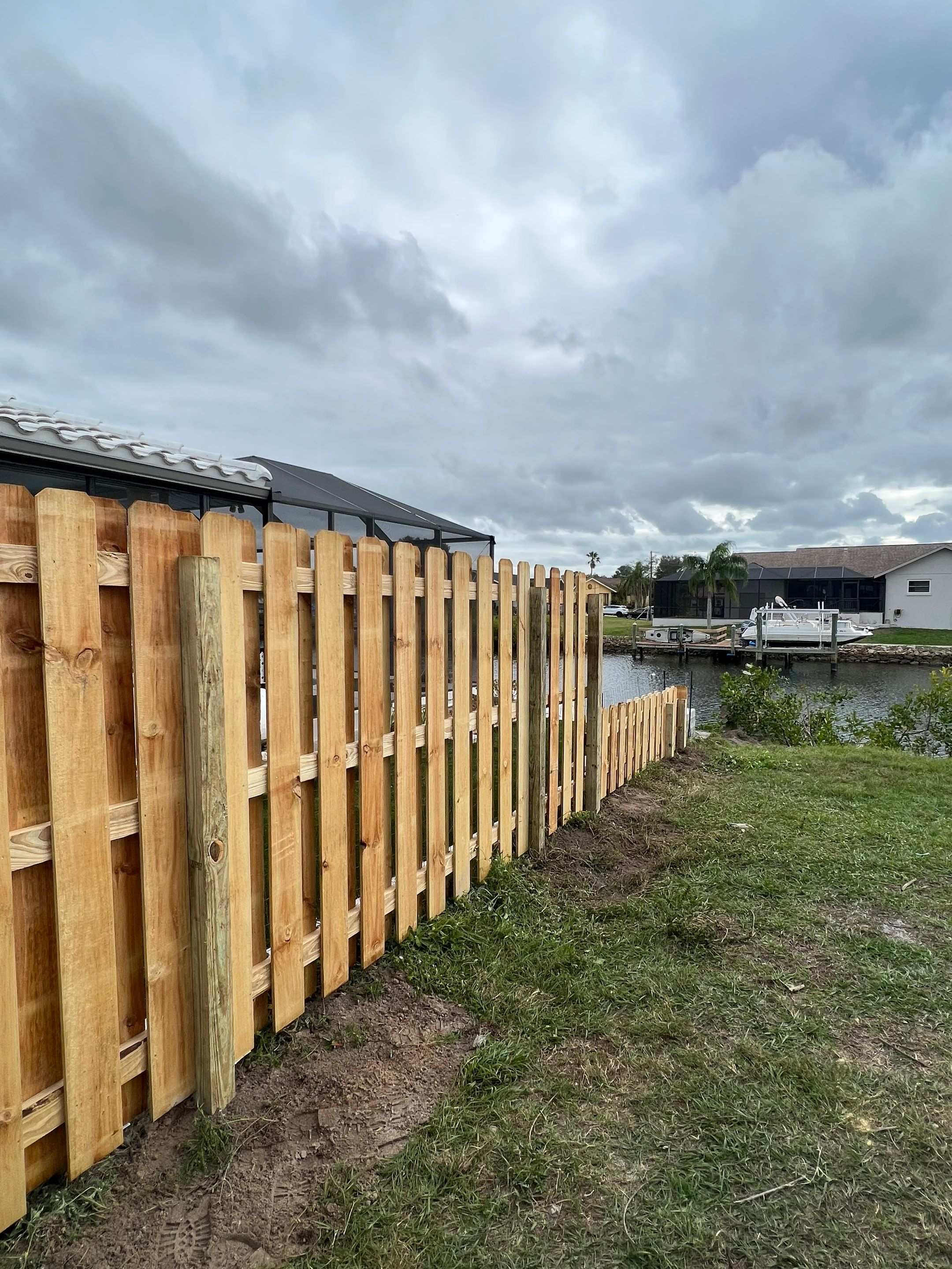 Wood Fence Installation using 6Ft Tall Pressure Treated Wood Shadowbox Fence by Asap fence and gates, LLC