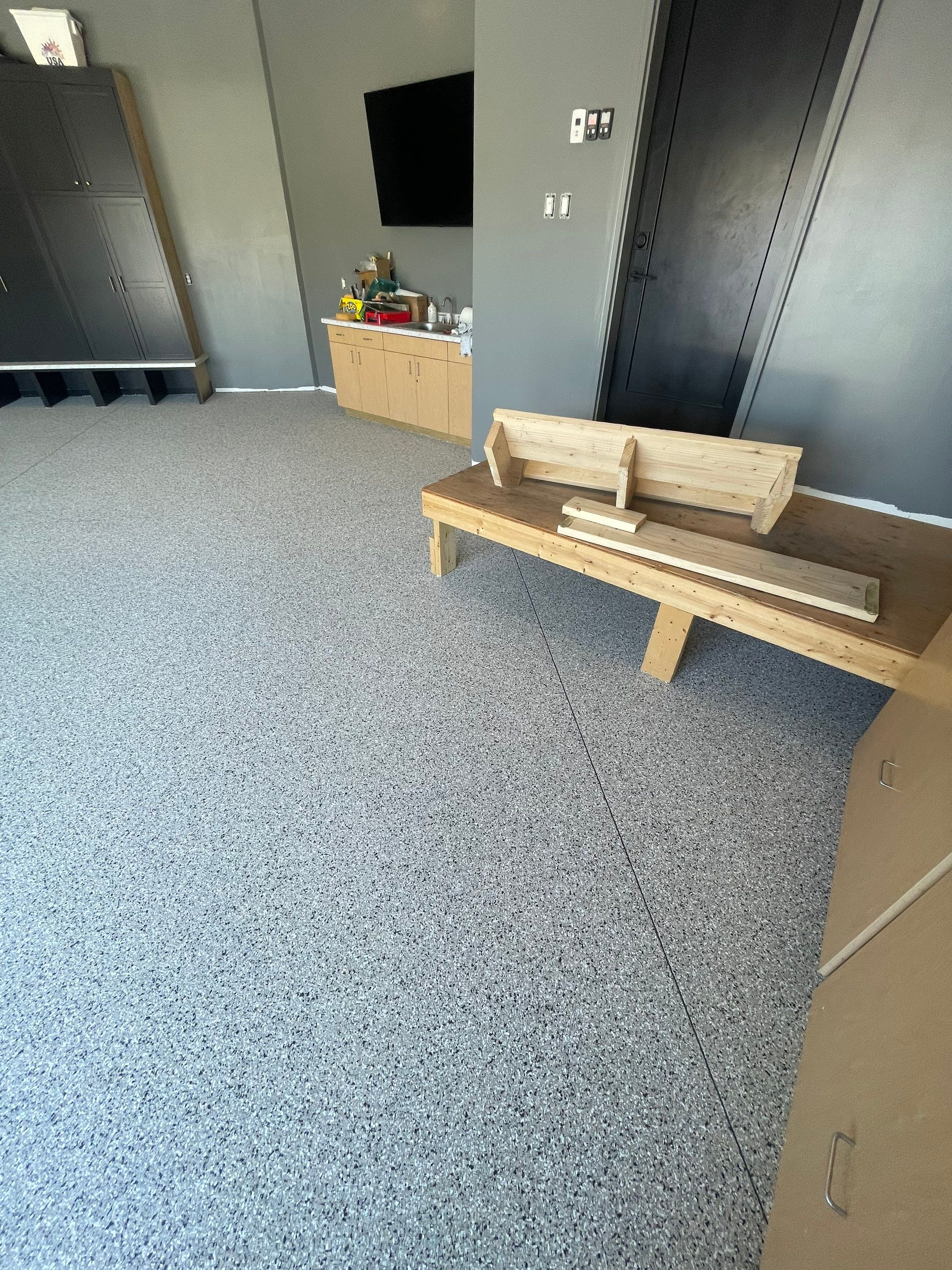 Custom Speckled Concrete Coating for Dell Rapids Garage by Select Painting, Coatings & Garage Cabinets