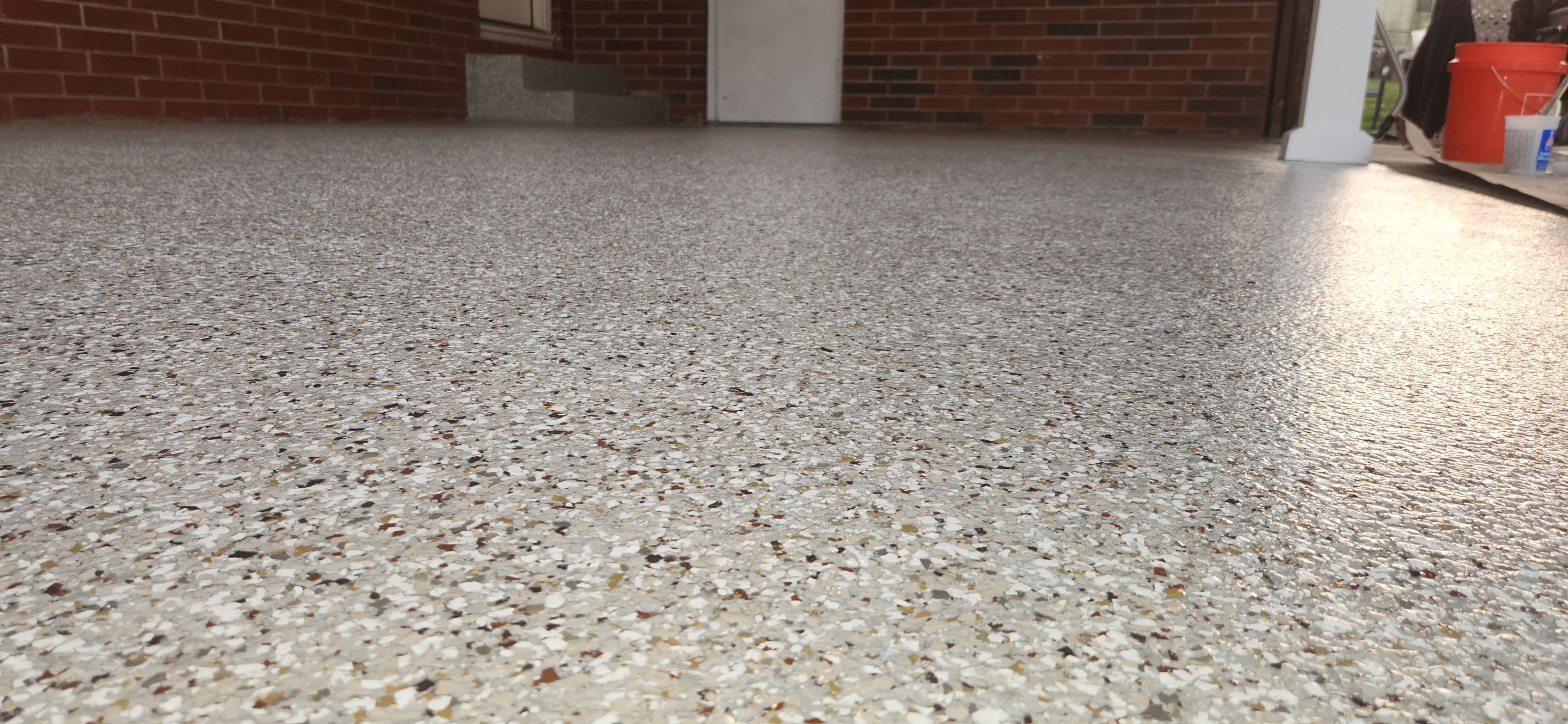 Back Patio using Creekbed by Elite Floor Solutions
